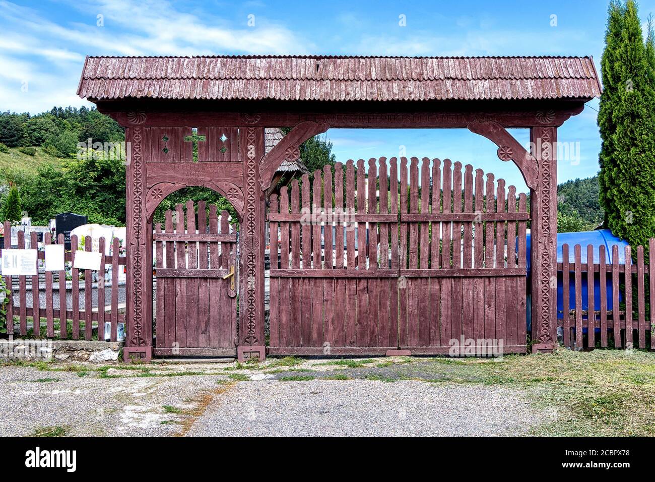 Szekler gate, an ornamental graveyard gate made only of wood Stock Photo