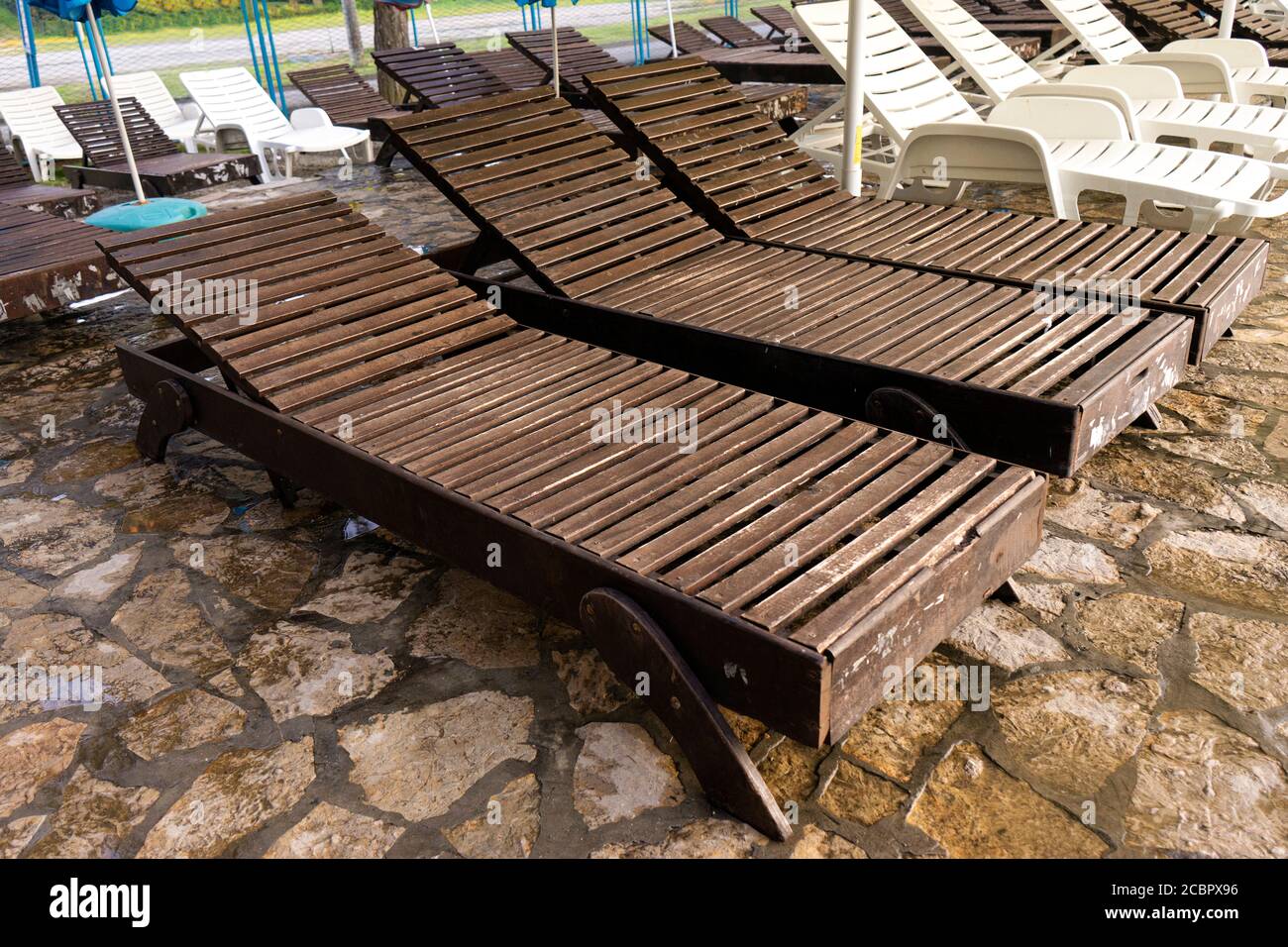 Wooden deck chairs on the beach Stock Photo - Alamy