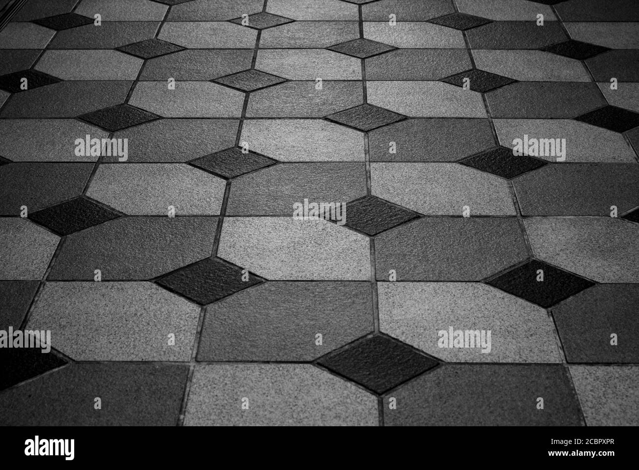 Floor with tiles arranged in geometric shapes Stock Photo