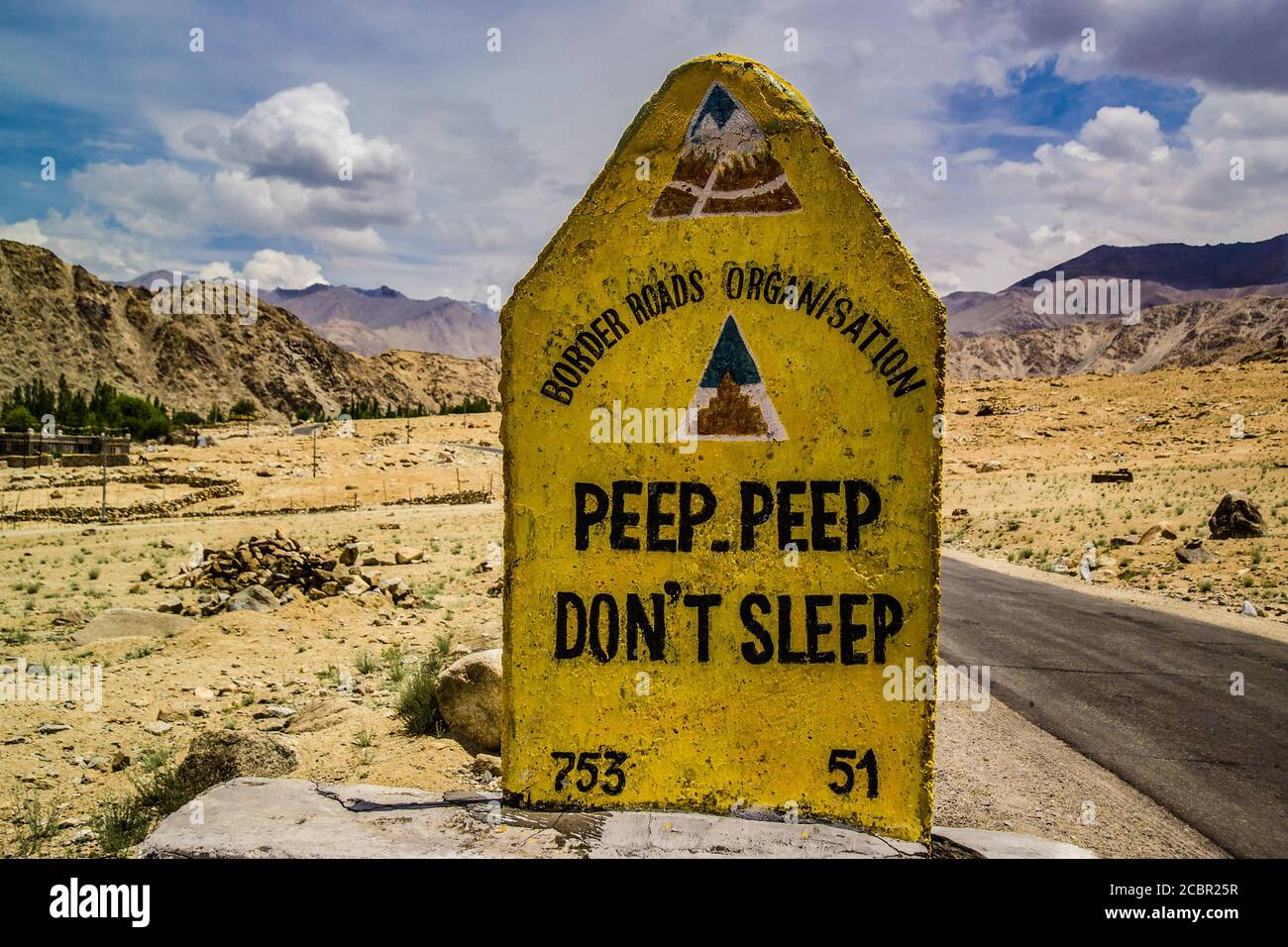 India, Ladakh, amusing warning post along the dangerous highway from Manali to Leh Stock Photo