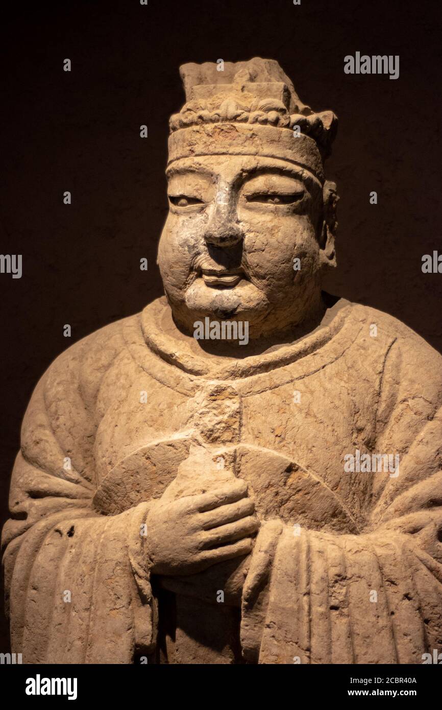 Luoyang, Henan Province / China - January 5, 2016: Ancient stone statue of nobleman, exhibition of ancient stone carving art in Luoyang Museum in Luoy Stock Photo