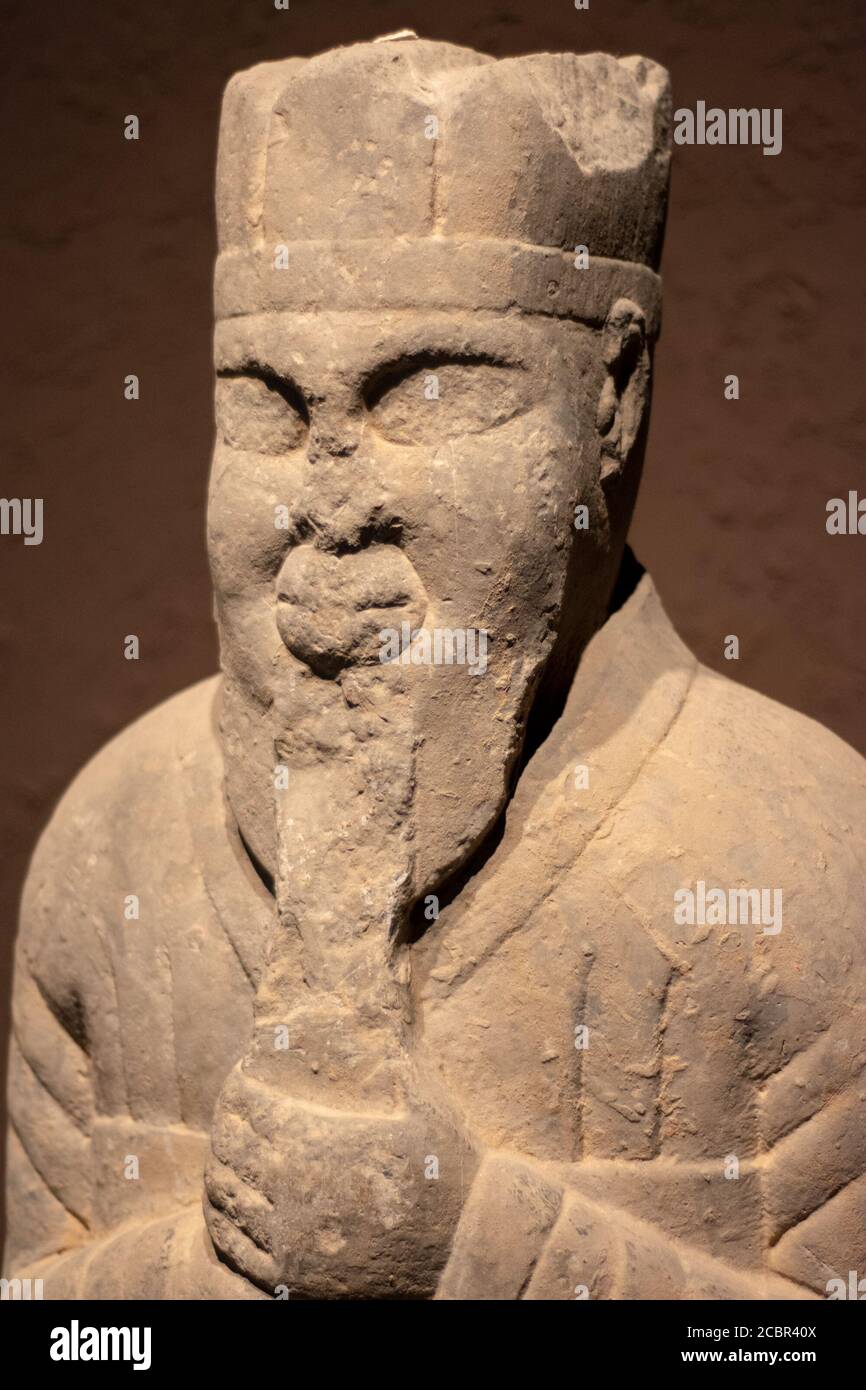 Luoyang, Henan Province / China - January 5, 2016: Ancient stone statue of nobleman, exhibition of ancient stone carving art in Luoyang Museum in Luoy Stock Photo