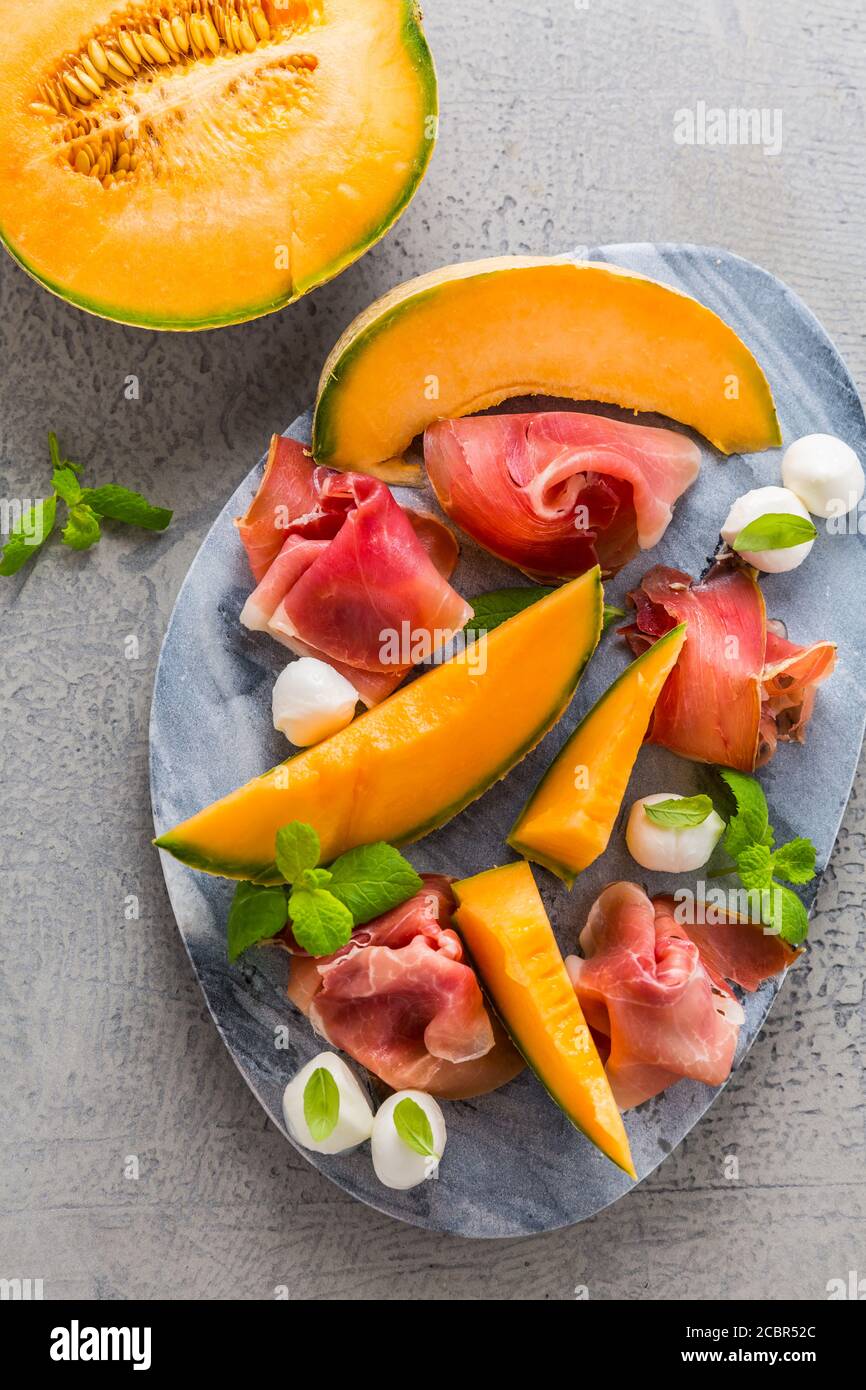 Traditional Italian appetizer Prosciutto with cantaloupe melon