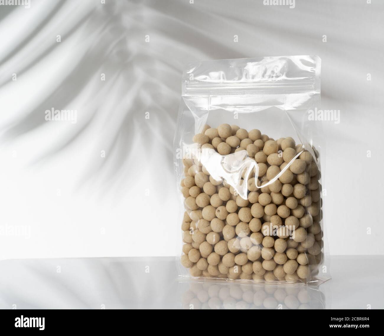 peanut product on blank plastic container Stock Photo