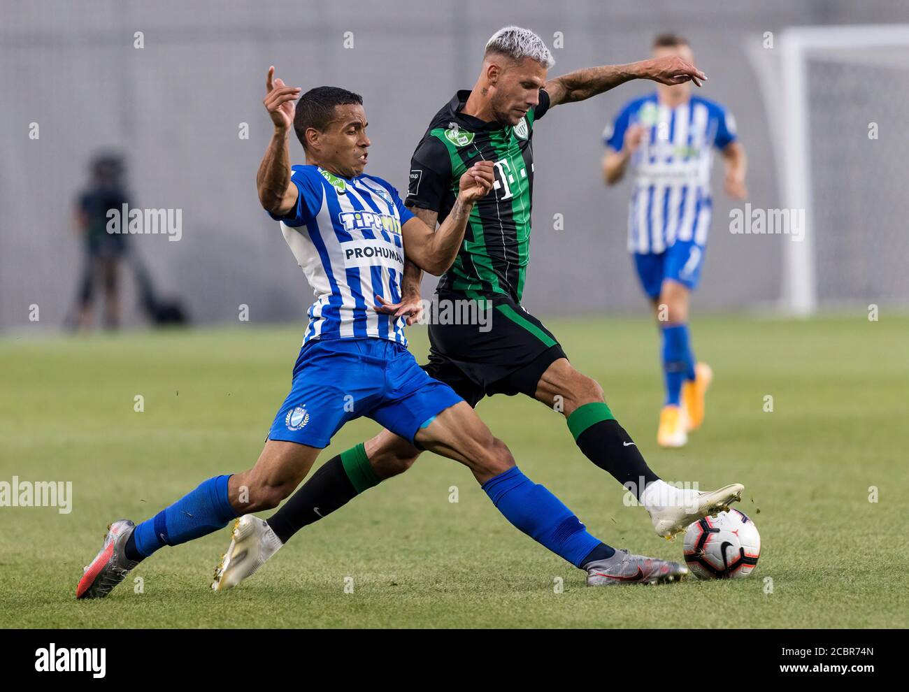 BUDAPEST, HUNGARY - JULY 12: (r-l) Roland Varga of Ferencvarosi TC hugs  goal scorer Stefan