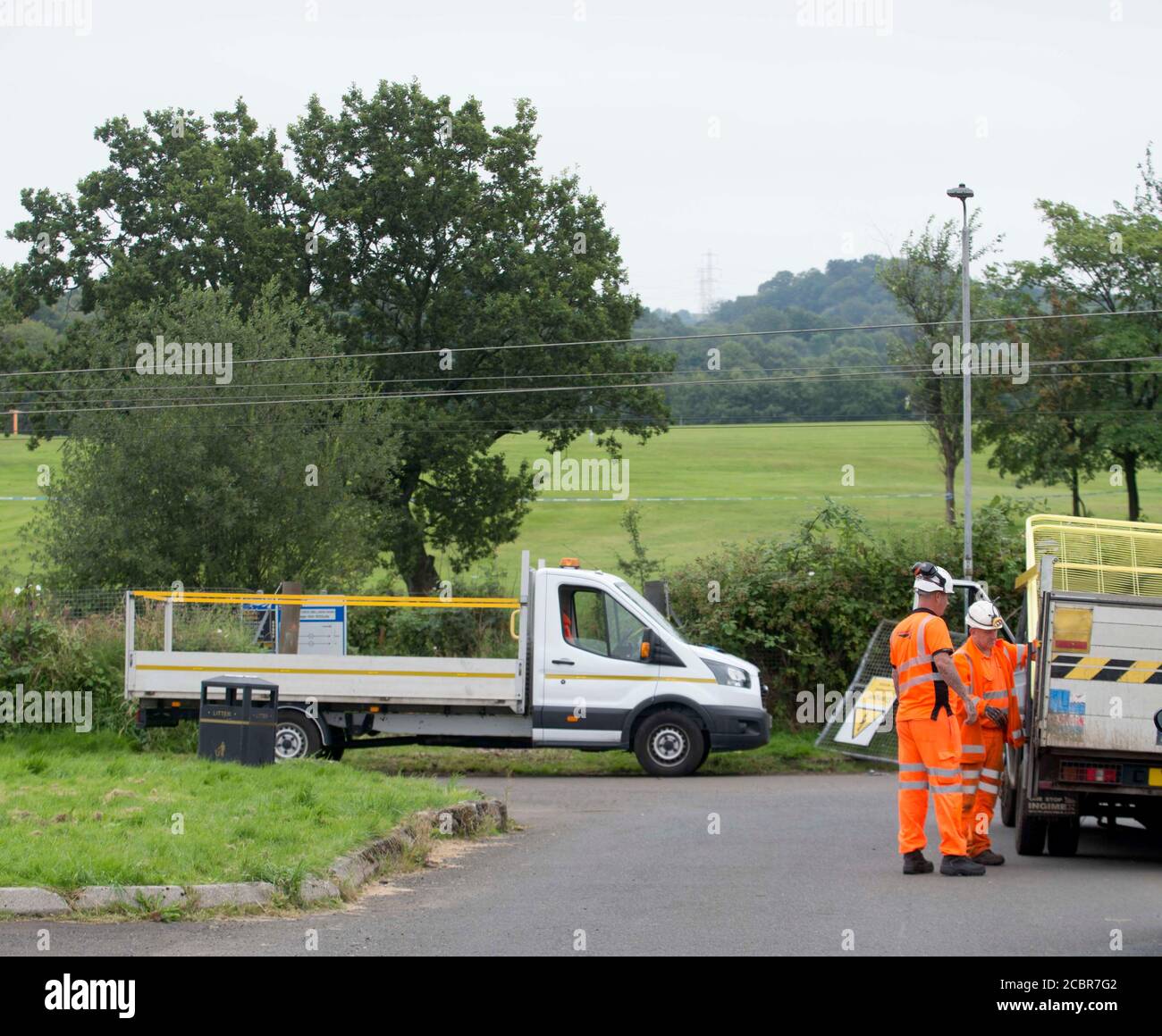 Johnstone, Scotland, 15th August,  2020  Workmen temporarily secure access gates on Janefield Avenue in Johnstone, Renfrewshire where a car crashed onto the railway line at 6am this morning. Stock Photo