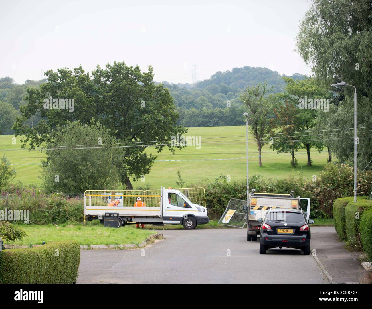 Johnstone, Scotland, 15th August,  2020  Workmen temporarily secure access gates on Janefield Avenue in Johnstone, Renfrewshire where a car crashed onto the railway line at 6am this morning. Stock Photo