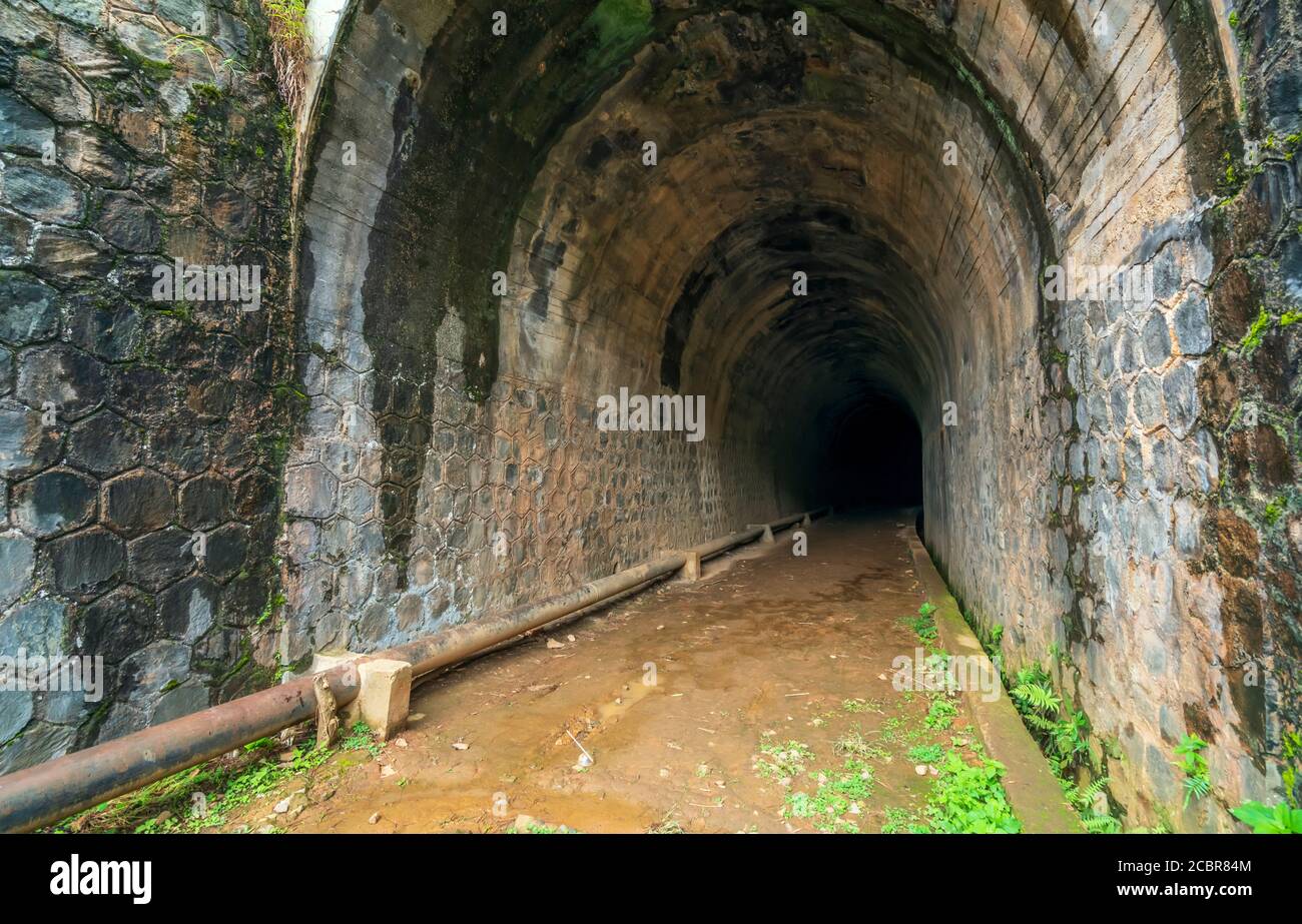 Abandoned Railway Tunnel in the plateau, French architecture built in the 19th century and exists today near Dalat, Vietnam. Stock Photo