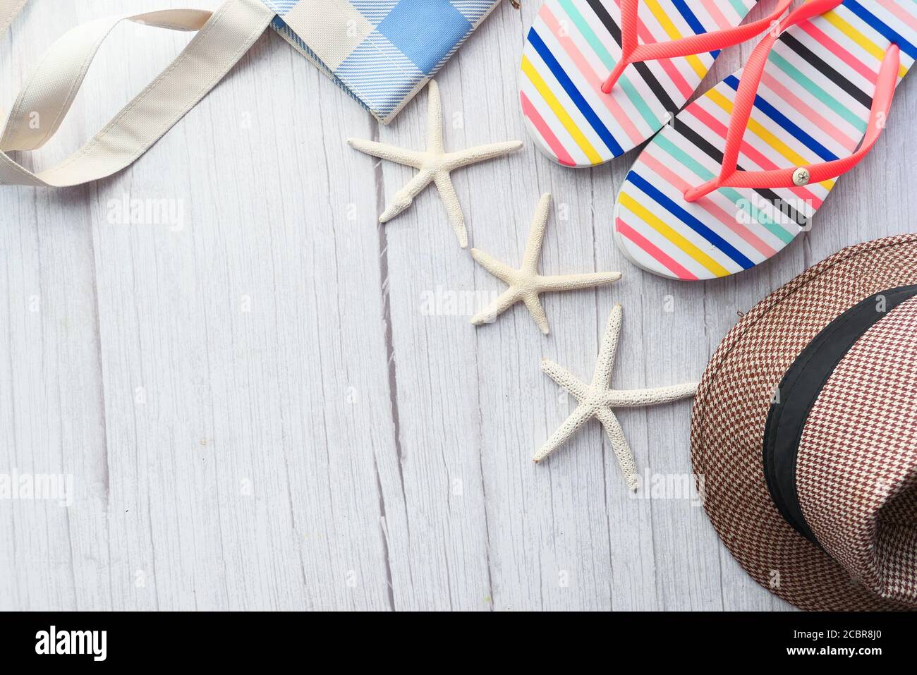 flat composition of summer beach accessories on table. Stock Photo