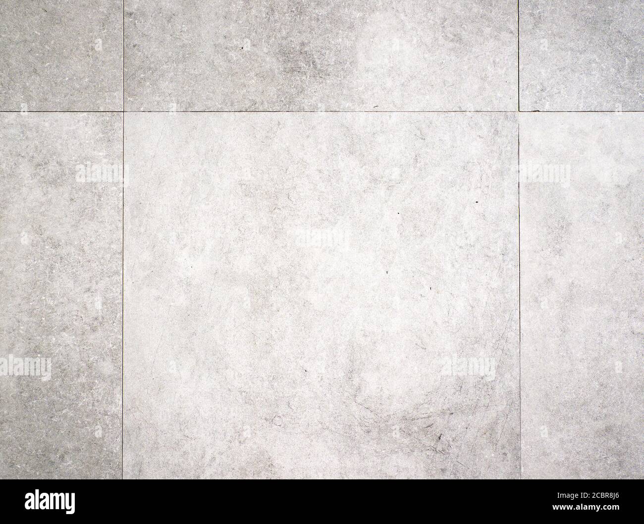 Light grey background texture of a concrete tile floor surface Stock Photo