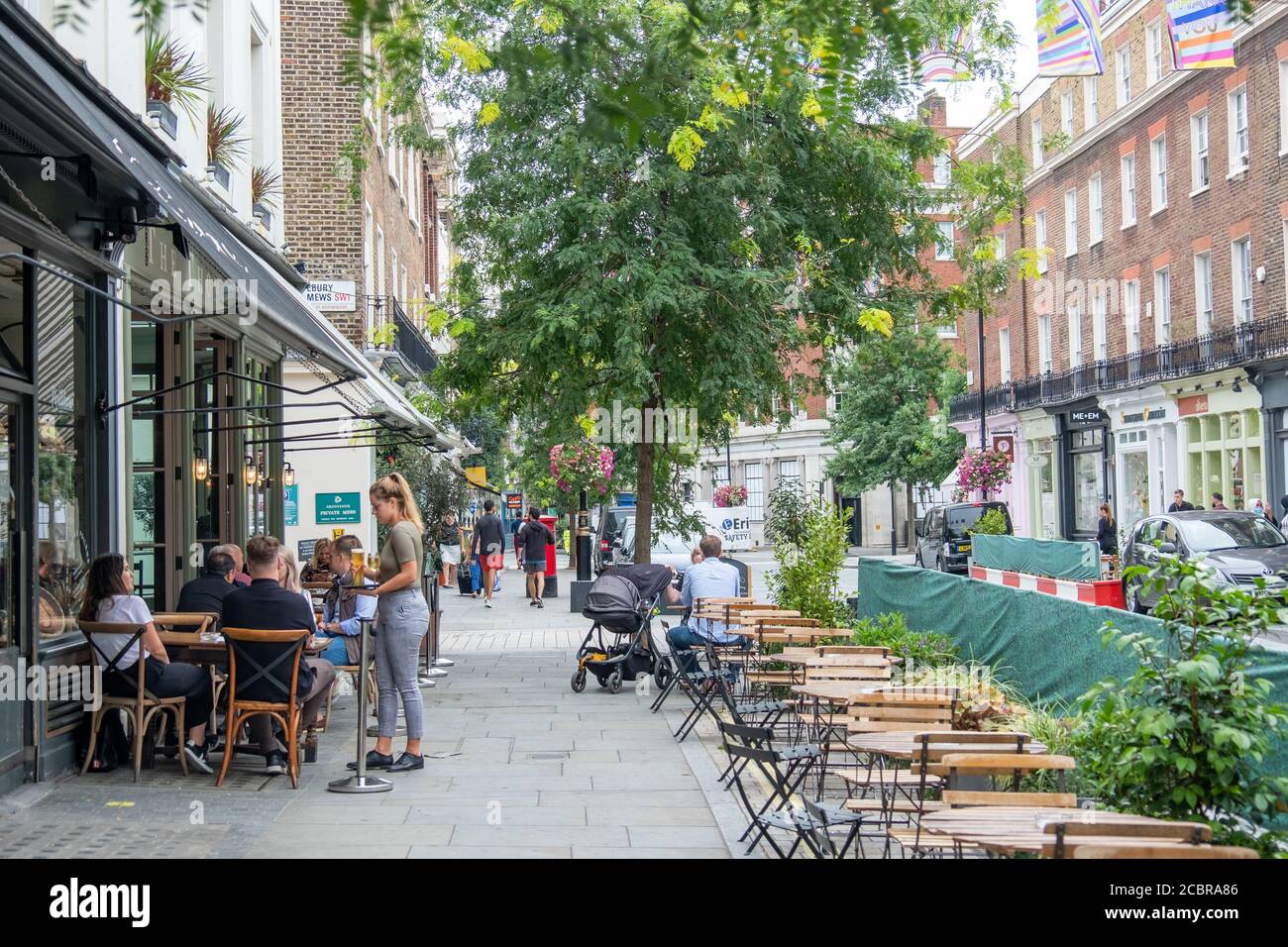 London- August, 2020:  Outdoor seating restaurant on Elizabeth Street in Belgravia, an upmarket street of shops and eateries close to Victoria Station Stock Photo