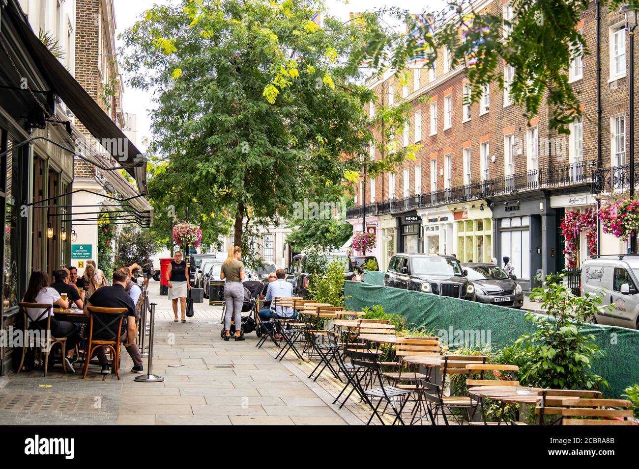 London- August, 2020:  Outdoor seating restaurant on Elizabeth Street in Belgravia, an upmarket street of shops and eateries close to Victoria Station Stock Photo