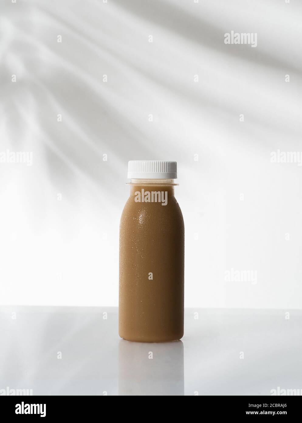 Download Coffee Product Mockup On Plastic Bottle Over White Background Stock Photo Alamy