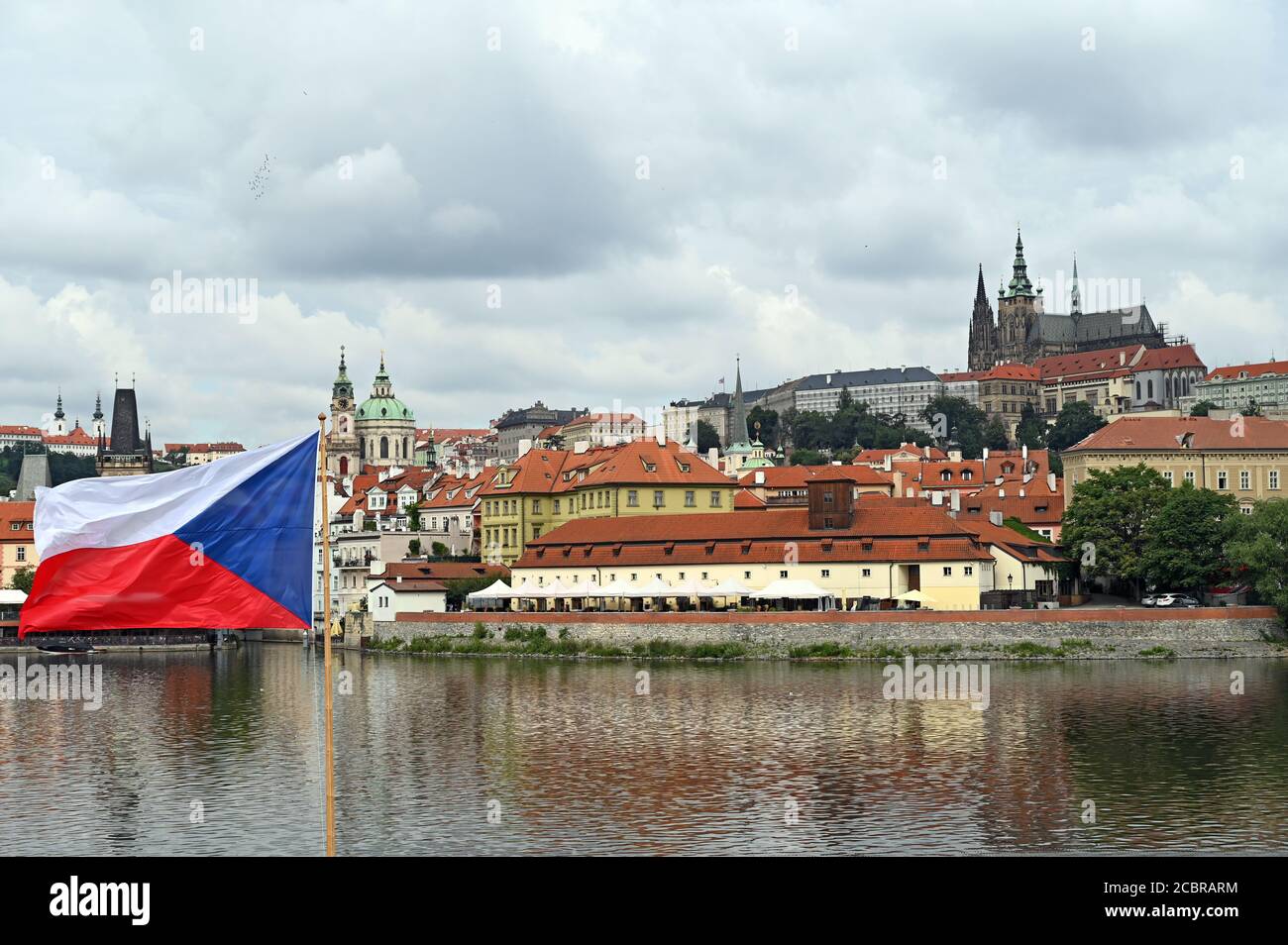 Prague Castle and Czech flag cityscape Stock Photo