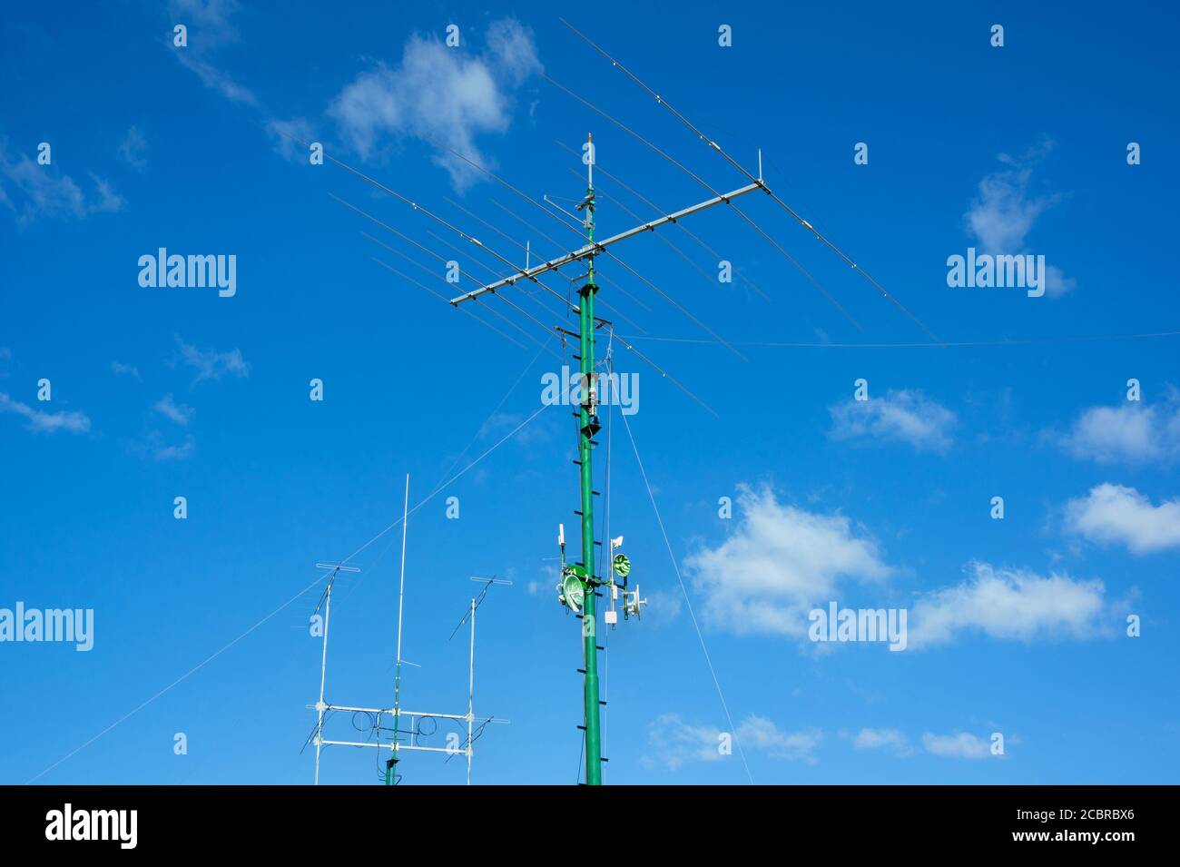 Antenna and satellite - equipment for receiving of data and signal. Aerial transmission of informations by transmitter. Modern technology. Stock Photo