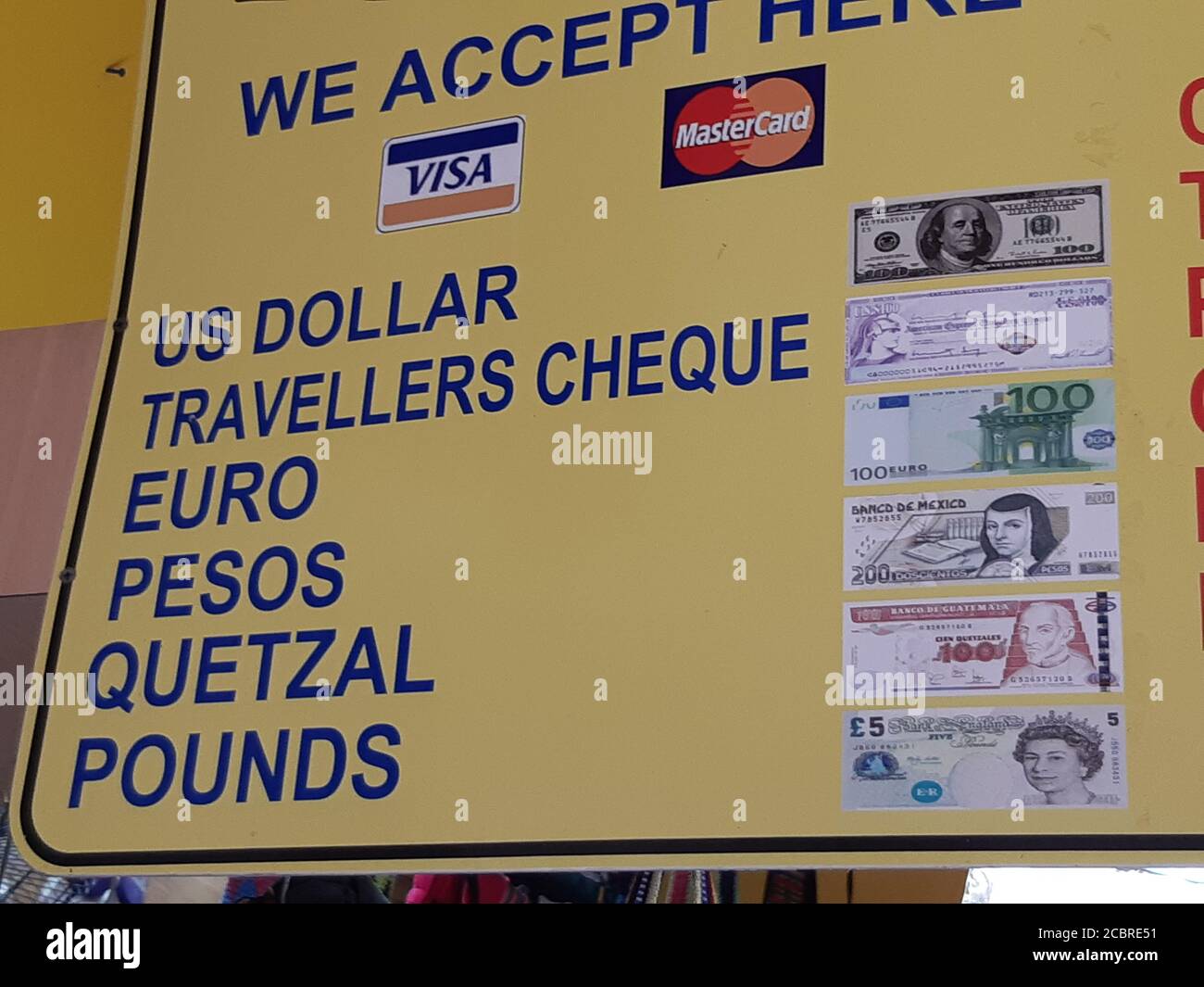 : List of currencies with pictures at local currency exchange office. Cancun / Mexico Stock Photo