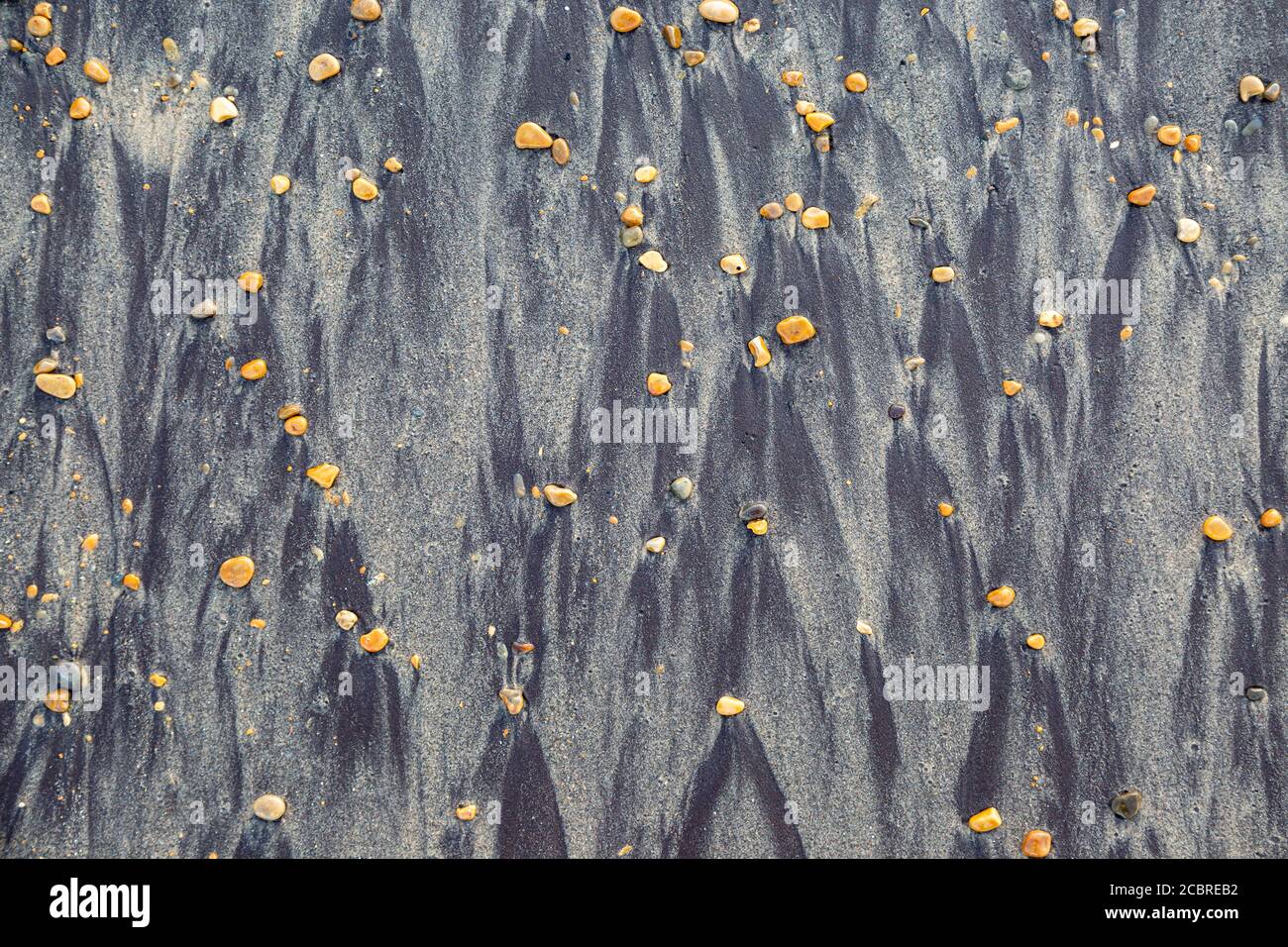 Patterns on a sandy beach from pebbles Stock Photo