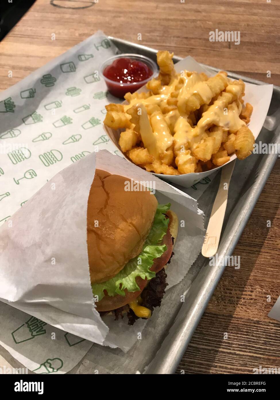 Shake Shack meal with burger, crinkle cut cheese fries and ketchup. Detroit, Michigan / USA Stock Photo