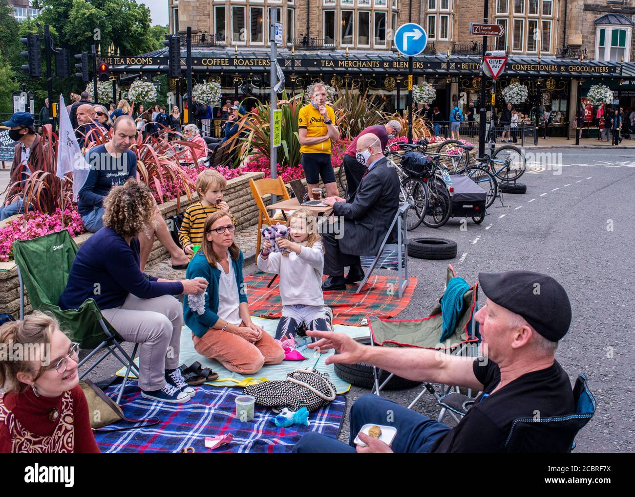 Harrogate, North Yorkshire, UK. 15th Aug, 2020. Members of Extinction Rebellion reclaim public areas in the centre of the town by occupying parking spaces. Credit: ernesto rogata/Alamy Live News Stock Photo