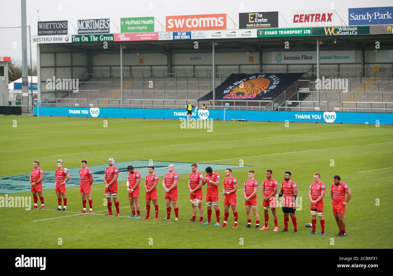 Leicester Tigers players during a moment of silence saluting the efforts of NHS and key workers, and remembering rugby fans who have died due to Covid-19 before the Gallagher Premiership match at Sandy Park, Exeter. Stock Photo