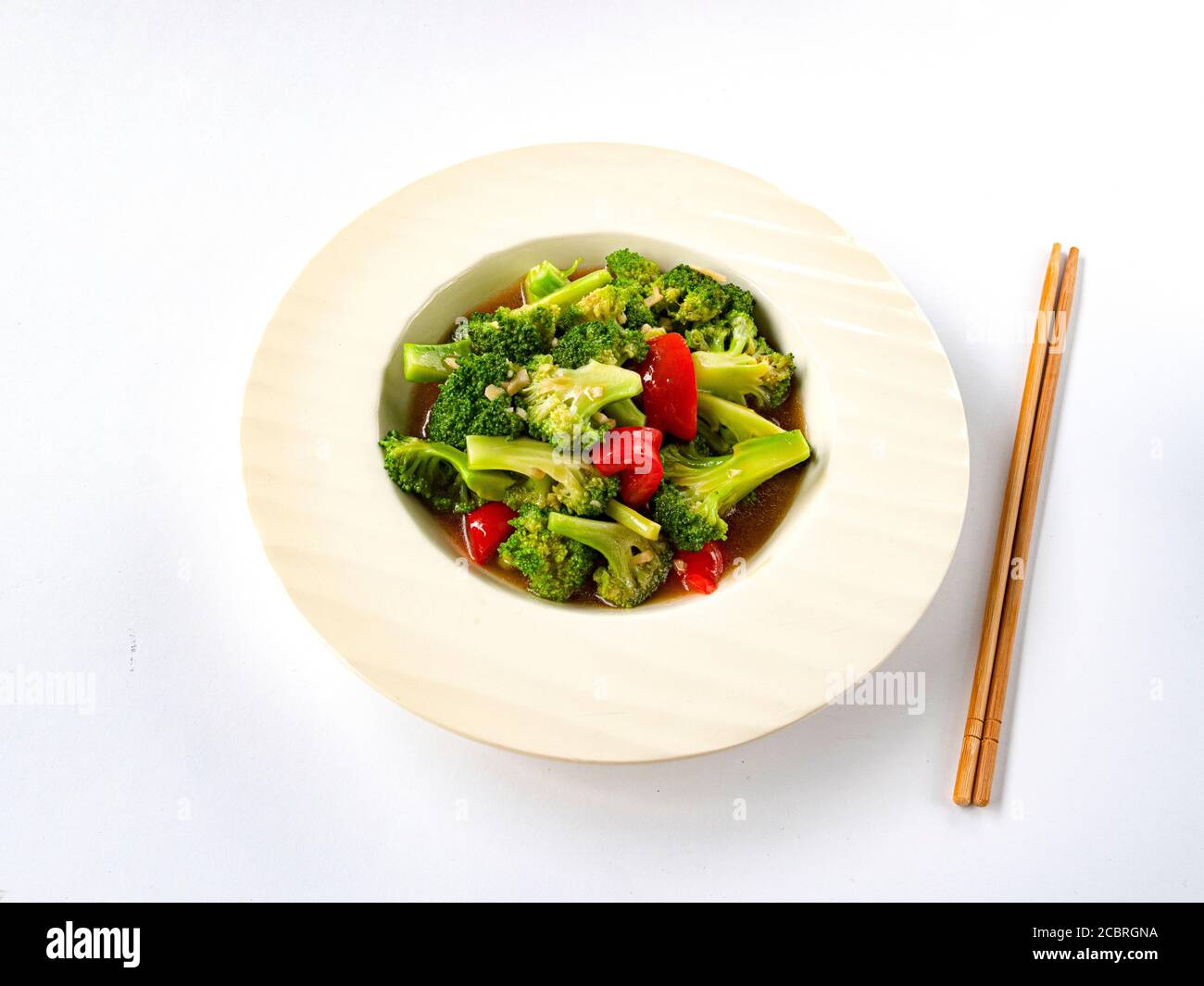 Vegetarian vegetable salad (bell pepper, black mushrooms, Chinese asparagus, broccoli, cauliflower, mushrooms, spices, onion oil, sesame oil) Stock Photo