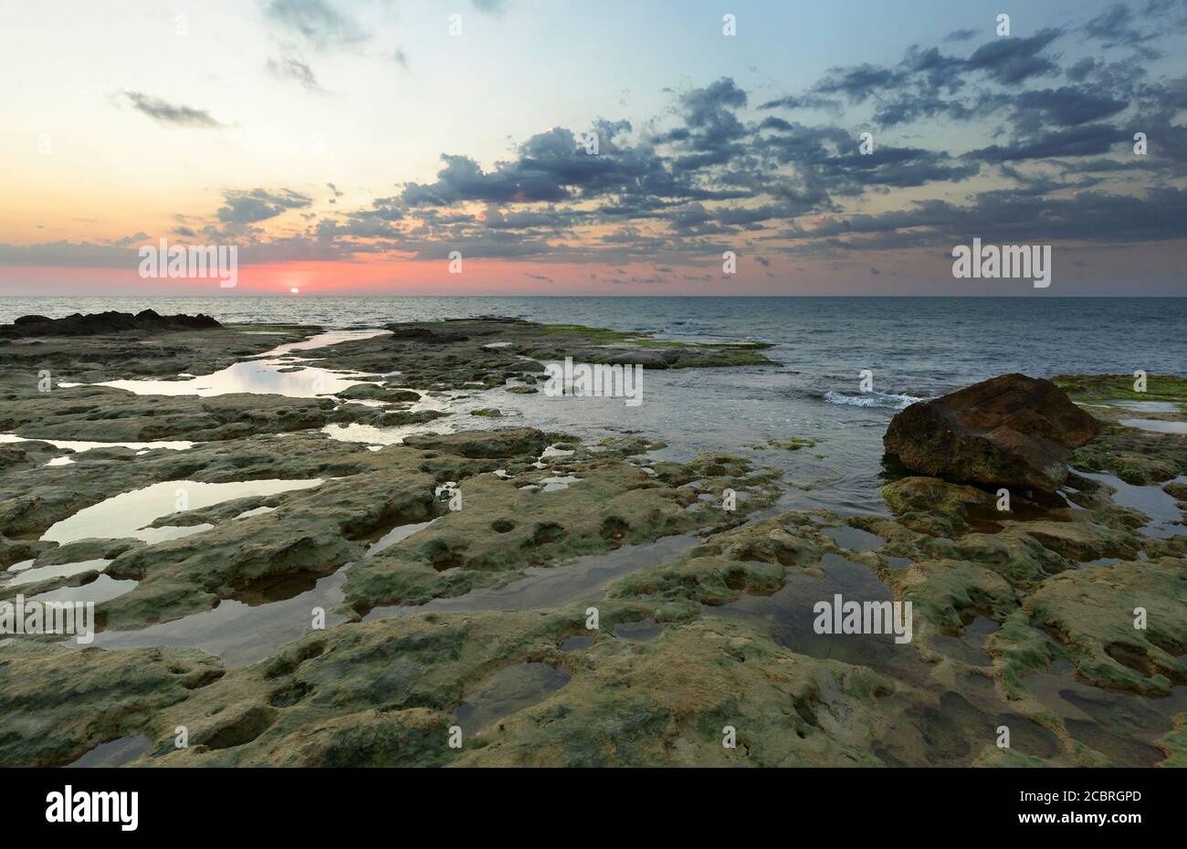 Sunrise at Cabo Cervera in Torrevieja, Alicante province in Spain. Horizontal shot with space for text. Stock Photo