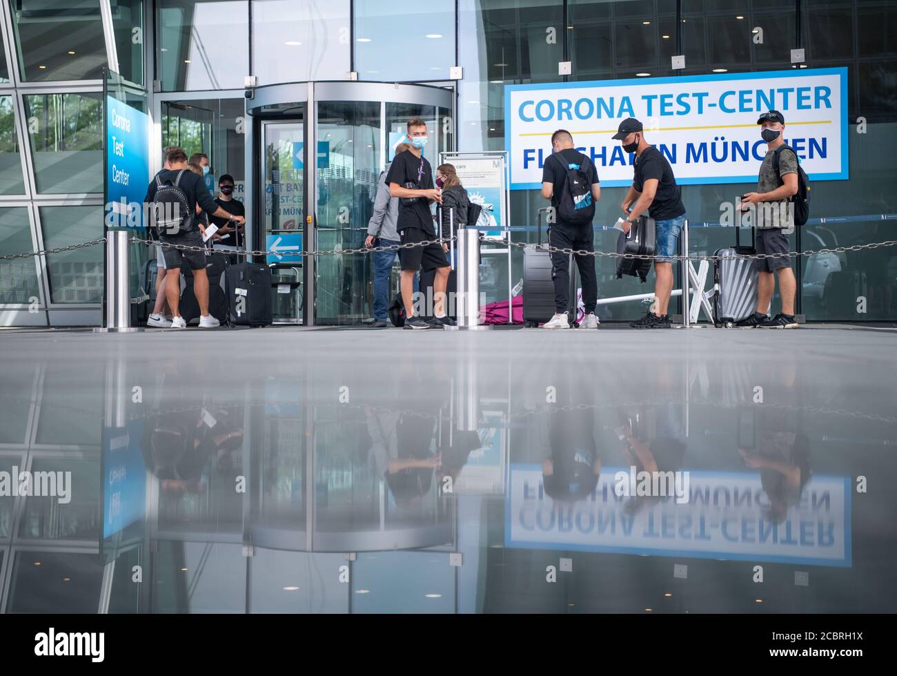 Freising, Germany. 15th Aug, 2020. Travellers returning to Germany are waiting for a coronavirus test at Munich airport. Germany issued a travel warning for all of Spain except the Canary Islands, requiring those who traveled to that destination to be tested upon return and remain in quarantine until a negative result is obtained. Credit: Lino Mirgeler/dpa/Alamy Live News Stock Photo