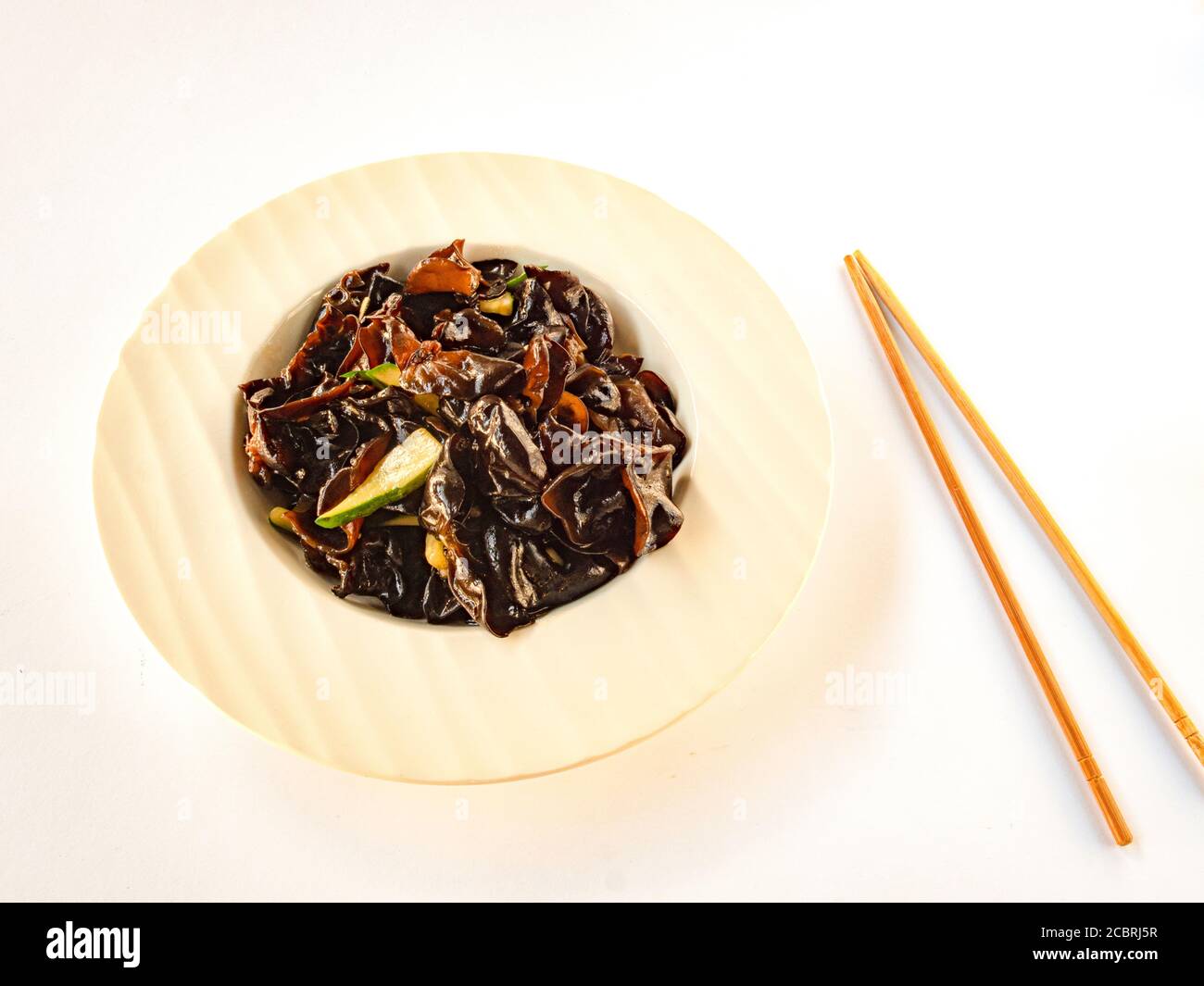 Pak Choi fried on a wok with Xiang mushrooms (Pak Choi cabbage, Shiitake  mushrooms, garlic, oyster sauce, soy sauce, spices Stock Photo - Alamy