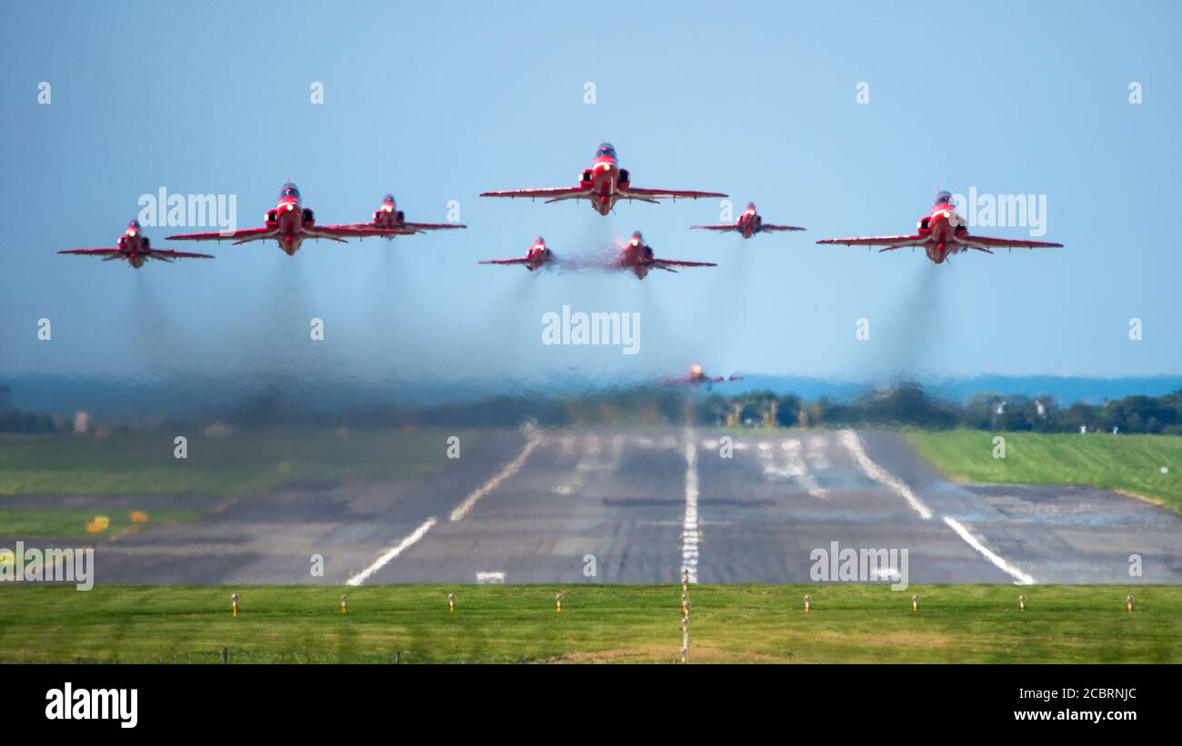 Prestwick, Scotland, UK. 15th Aug, 2020. Pictured: On the 75th Anniversary of VJ Day (Victory in Japan Day) celebrating the end of the Second World War the Royal Airforce (RAF) Red Arrows aerobatic display team are seen taking off from Prestwick International Airport, en route to Belfast for the next leg of their next flypast, ultimately ending in London later this evening for a flypast. Credit: Colin Fisher/Alamy Live News Stock Photo