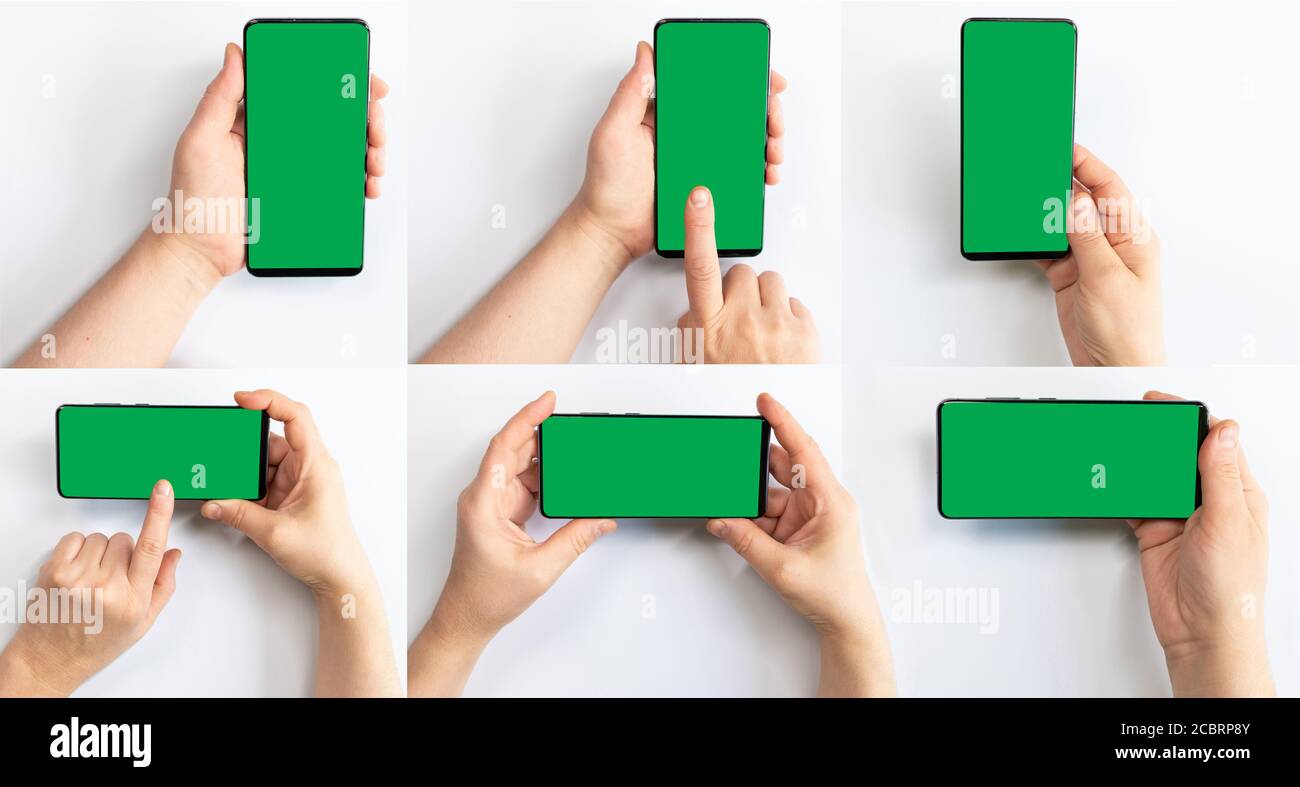 Woman holding green screen mobile phone with a white background Stock ...