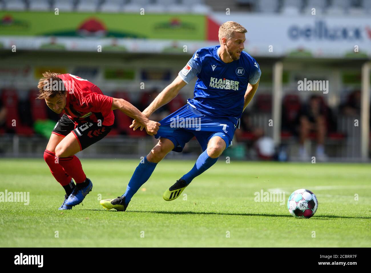 Marc Lorenz (KSC) in a duels with Amir Abrashi (Freiburg). GES/Football/2. Bundesliga: Test match: SC Freiburg - Karlsruher SC, August 15, 2020 Football/Soccer: 2. Bundesliga: Test match SC Freiburg vs KSC, Freiburg, August 15, 2020 | usage worldwide Stock Photo