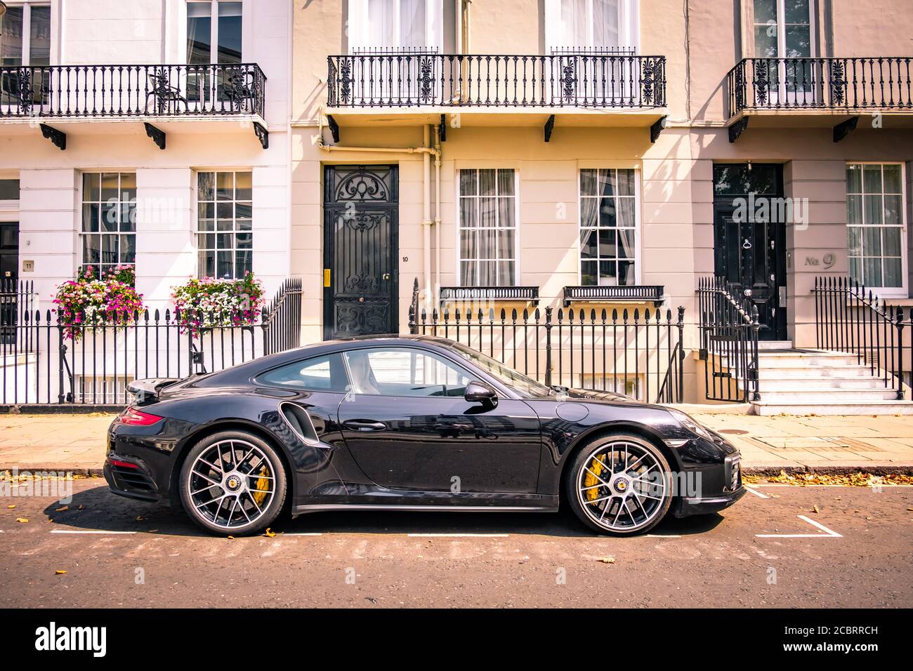 London- Porsche parked outside terraced townhouses in Knightsbridge Stock Photo