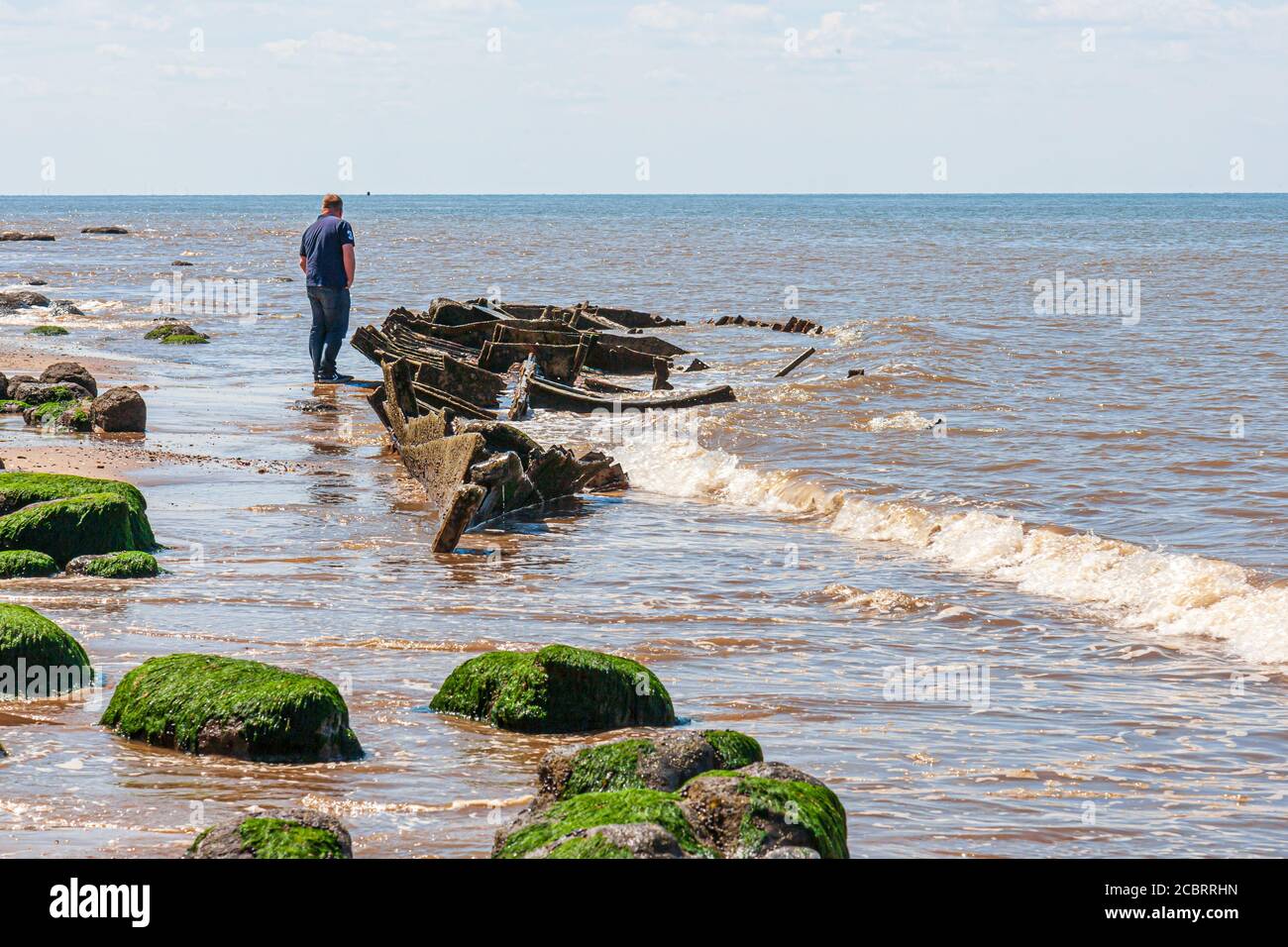 The remains of The Sheraton, a steam trawler built in 1907, can still be seen when the tide goes out.at hunstanton norfolk Stock Photo