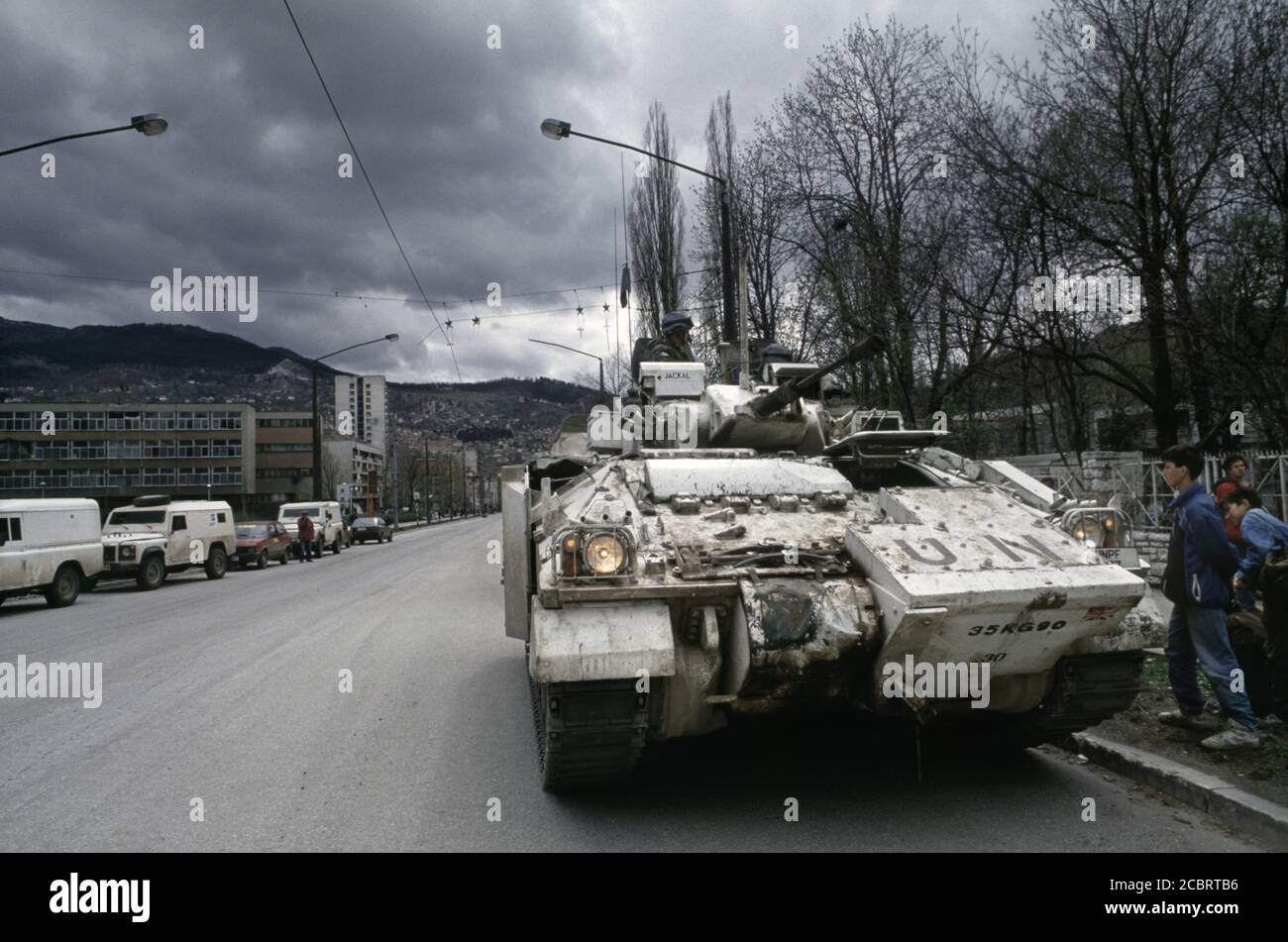 13th April 1994 During the Siege of Sarajevo: local boys take an interest in a British Army Warrior MCV on Alipašina Street. Stock Photo