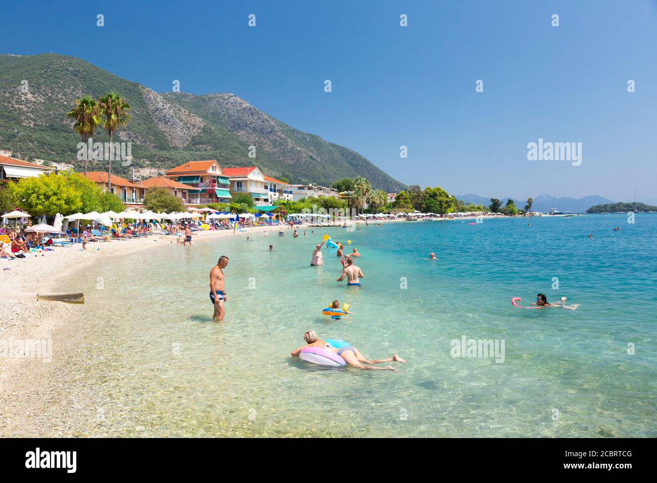 Tourists at Nidri Beach, Lefkada, Ionian Islands Greece Stock Photo