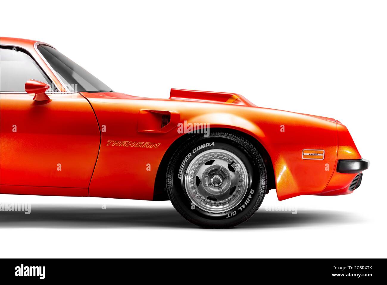 Izmir, Turkey - July 11, 2020: Orange colored Side front view of a 1974 Pontiac Trans Am Brand muscle car on a white background studio shot. Stock Photo
