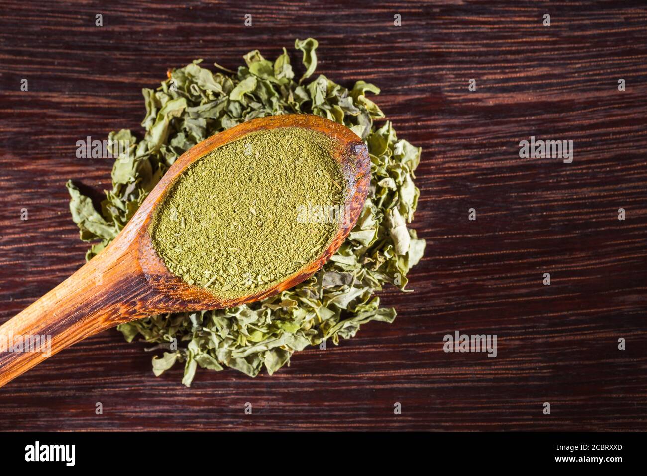 dried leaves and moringa powder on the table, Moringa oleifera Stock ...