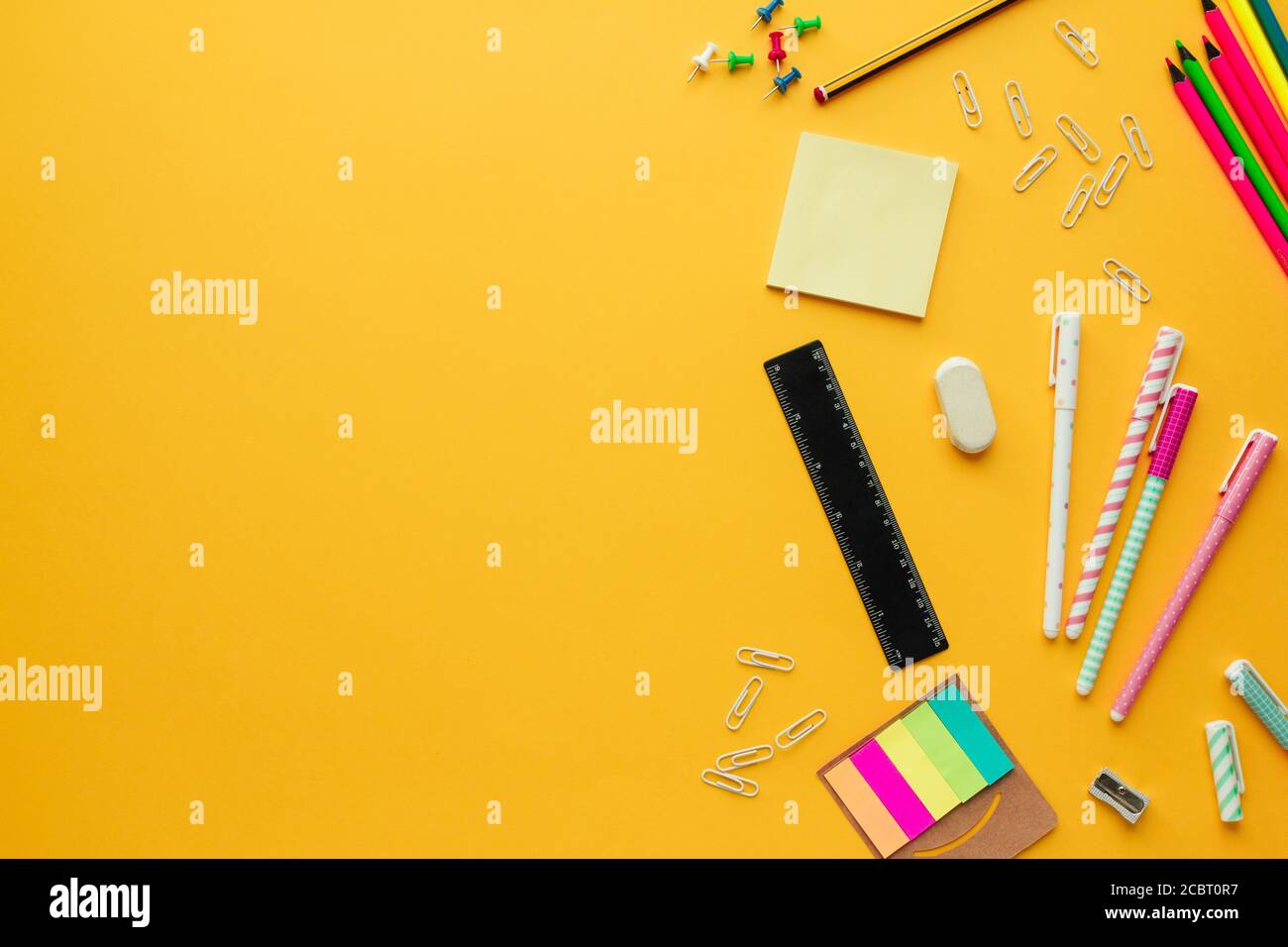 Stock photo of back to school concept with several stationery objects and copy space on the left to insert text Stock Photo