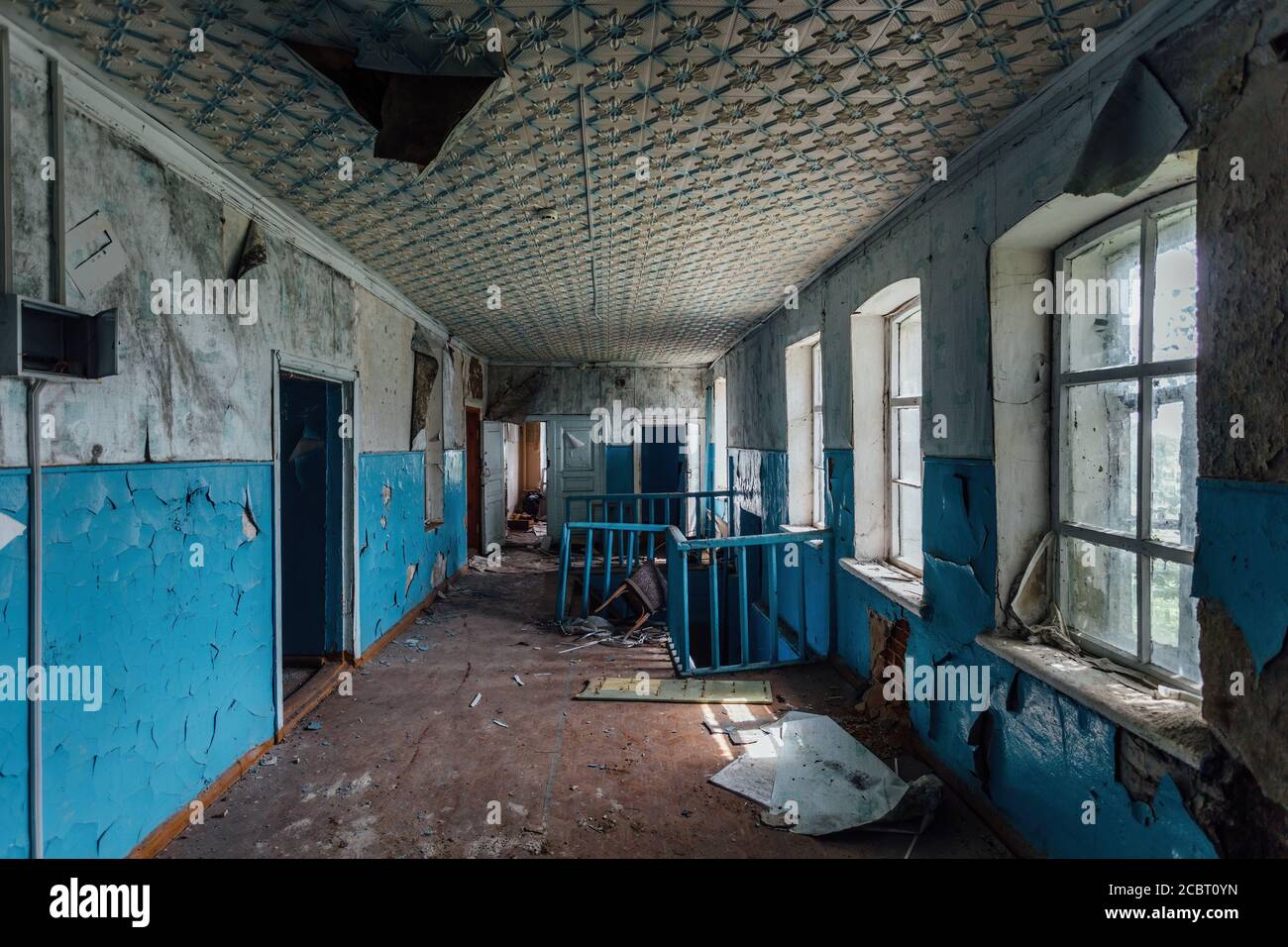 Abandoned school interior, dirty room, rotten peeled walls Stock Photo