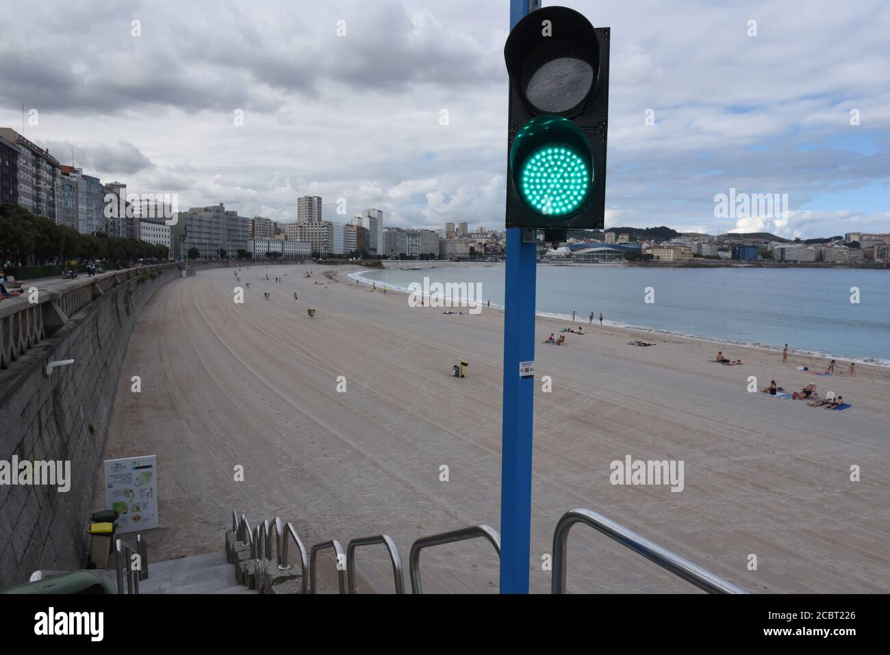 A traffic light system is seen at Orzán beach that allows or prohibits people from entering the beach based on the number of sunbathers already at the beach.The Spanish city A Coruña has recorded 600 new active cases of Coronavirus (Covid-19) after a wide return of the virus in the region. Credit: SOPA Images Limited/Alamy Live News Stock Photo