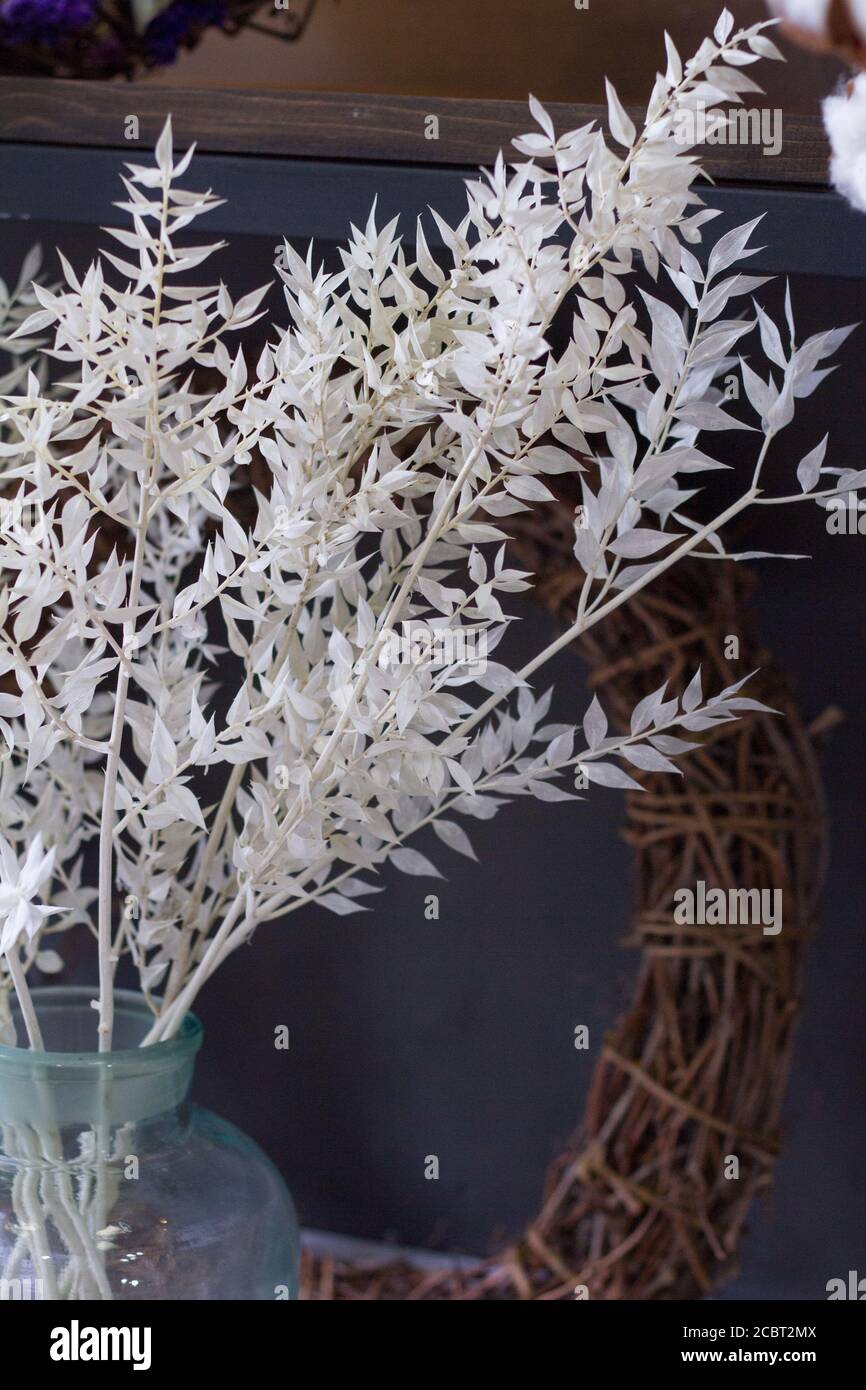 Florist shop interior, shelves with vases of dried flowers, bouquets of dried flowers, selective focus Stock Photo