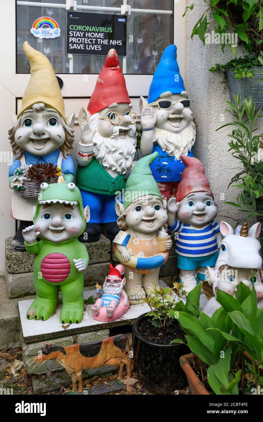 Gnomes at Flushing with a coronavirus stay at home sign in the background. Stock Photo