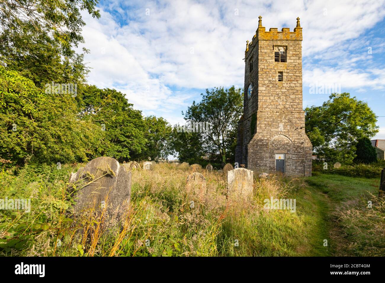 The bell tower at Illogan Church Yard in Cornwall.  The image was captured on a morning in early July. Stock Photo