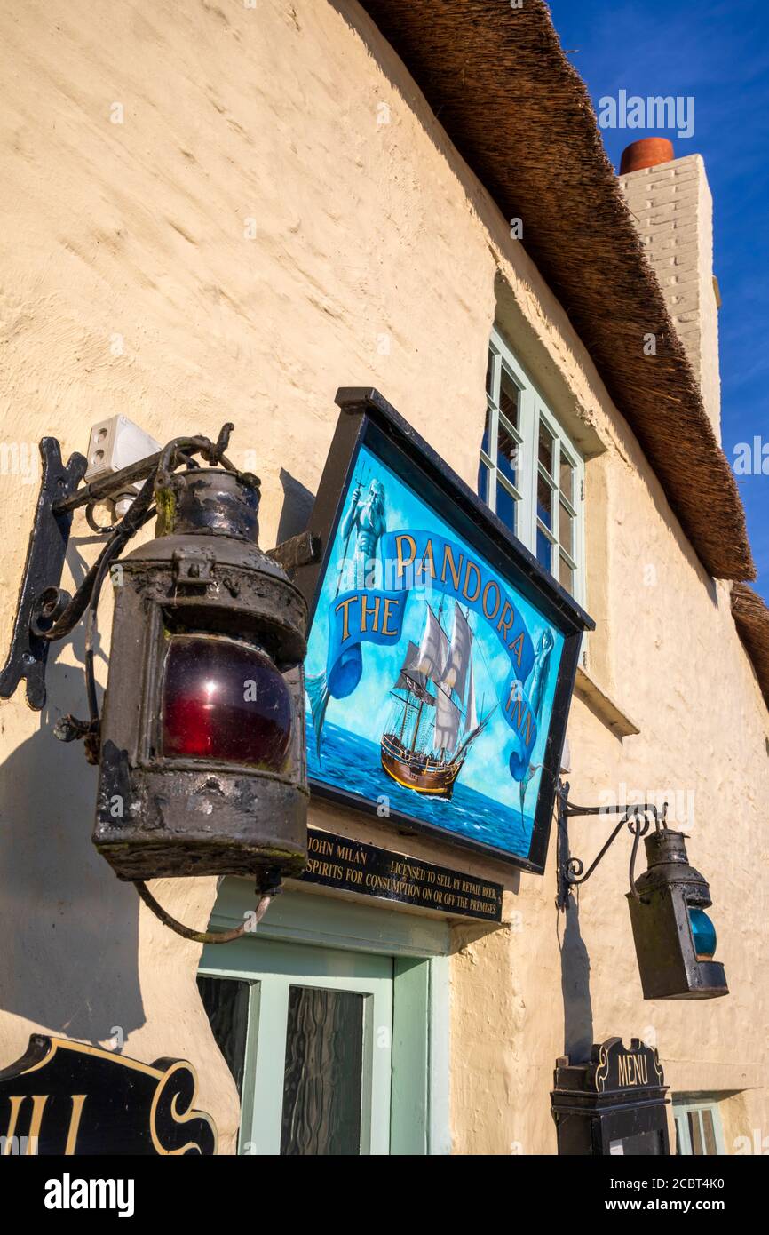 A sign over the main doorway into The Pandora Inn on Restronguet Creek near Mylor in Cornwall. Stock Photo