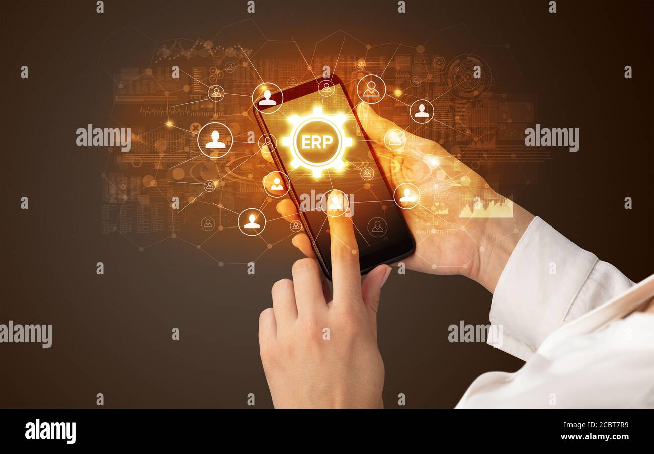 Female hand holding smartphone with ERP abbreviation, modern technology concept Stock Photo