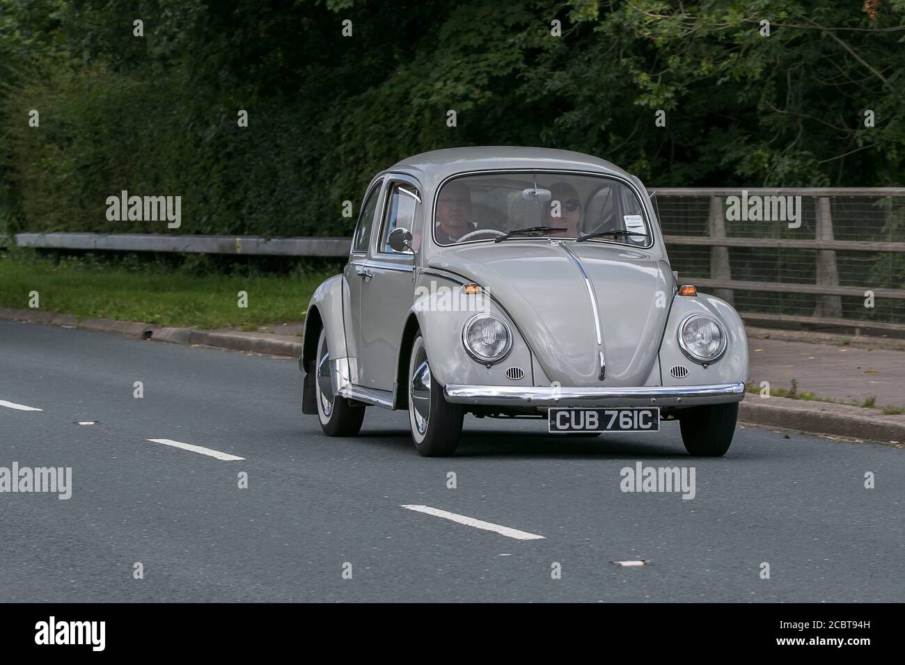 1965 grey VW Volkswagen Beetle driving on the M6 motorway near Preston in Lancashire, UK. Stock Photo