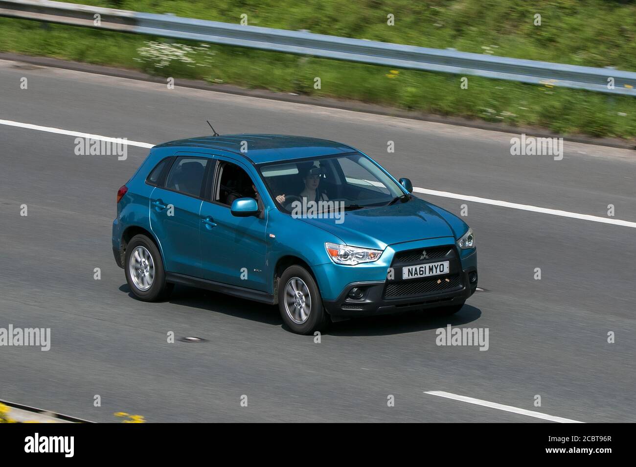 2012 Mitsubishi Asx 2 Clear Tec Blue Car SUV Petrol driving on the M6 motorway near Preston in Lancashire, UK. Stock Photo