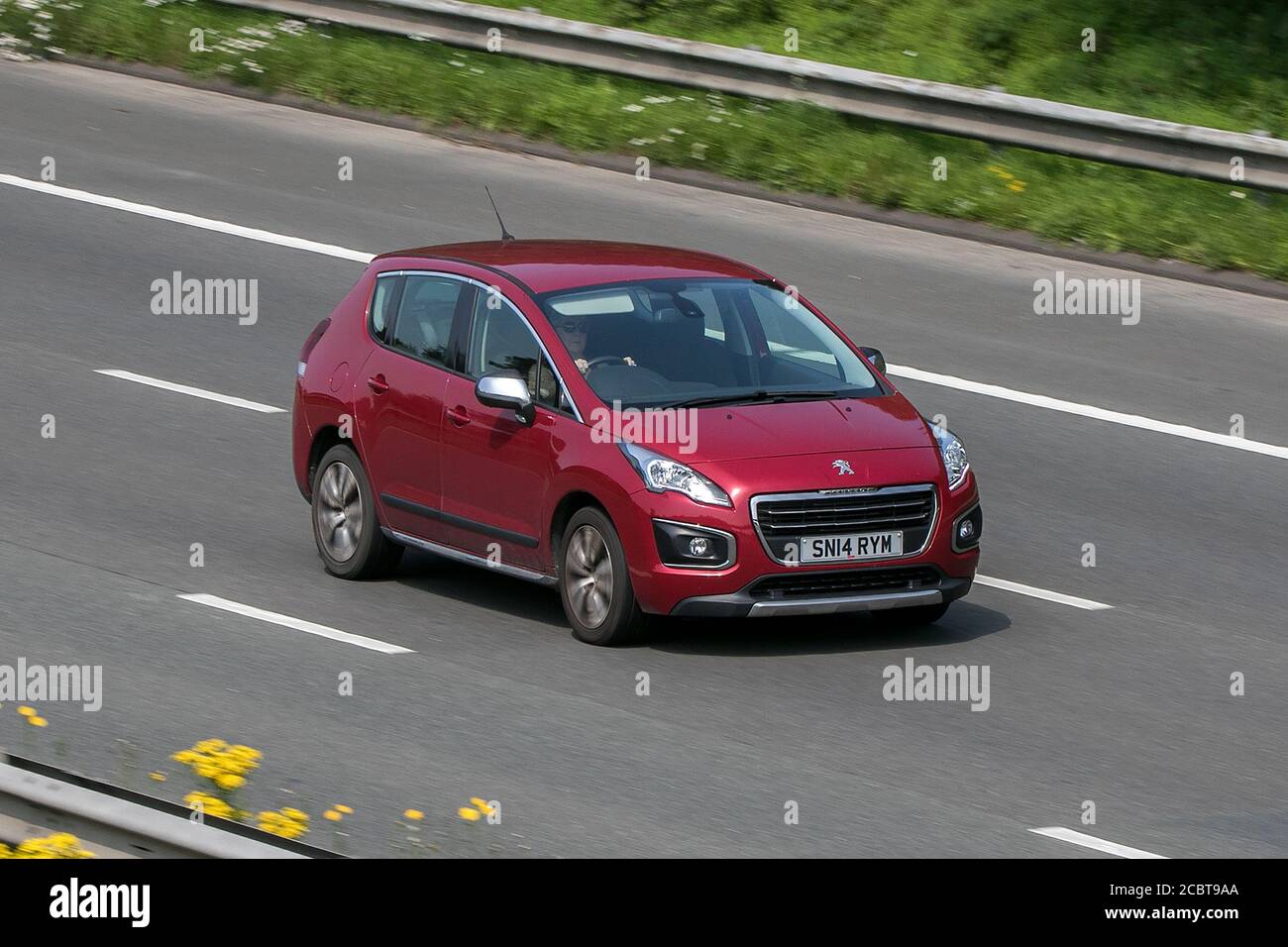 2014 Peugeot 3008 Active Hdi Red Car SUV Diesel driving on the M6 motorway near Preston in Lancashire, UK. Stock Photo