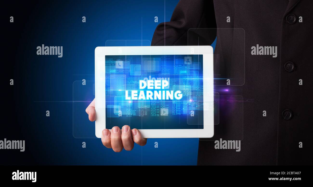 Young business person working on tablet and shows the inscription: DEEP ...