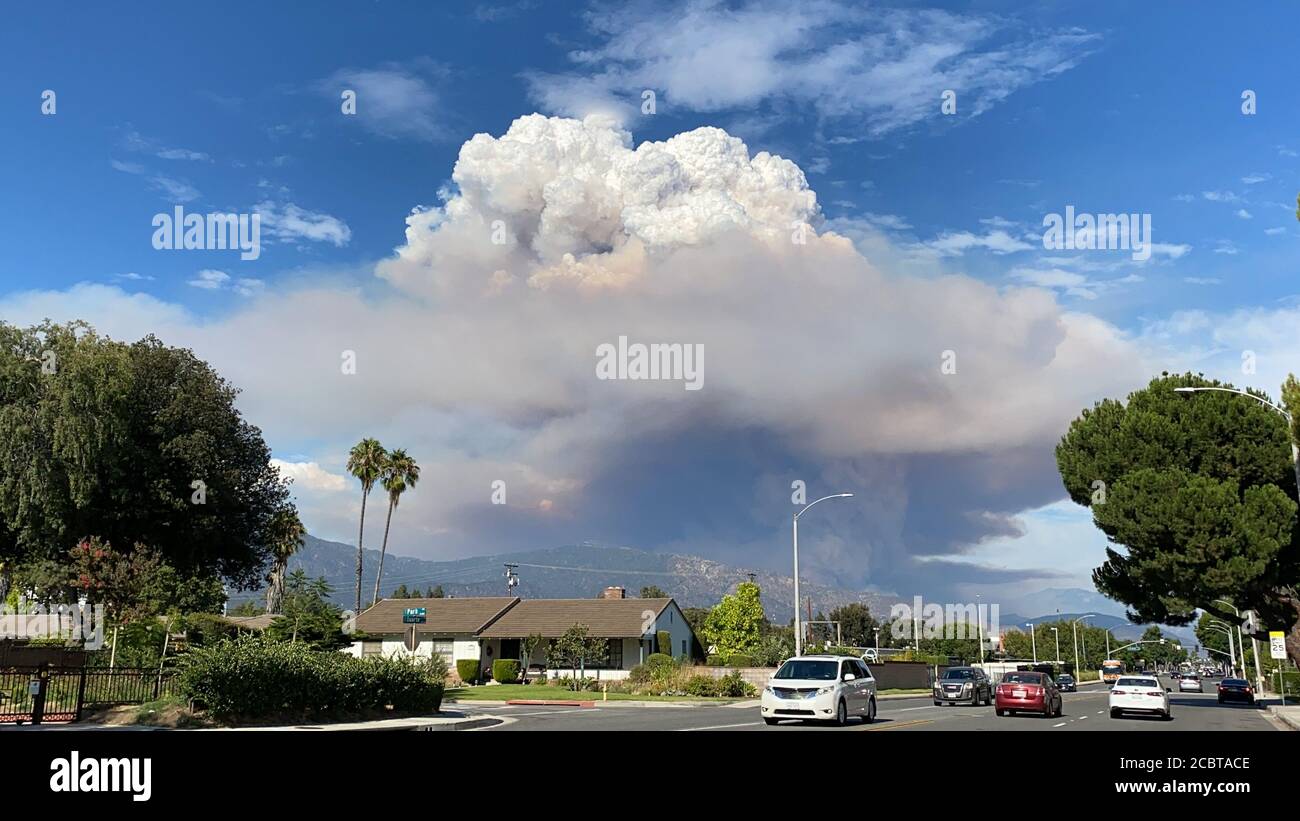 Los Angeles, USA. 13th Aug, 2020. Photo taken on Aug. 13, 2020 shows the dust cloud from the so-called Ranch 2 Fire in Los Angeles County, the United States. Smoke from several wildfires burning in Southern California has caused unhealthy air quality, authorities said on Aug. 15. The so-called Ranch 2 Fire, burning in the Angeles National Forest north of Azusa, has scorched 1,400 acres (around 5.66 square kilometers) and was only 3 percent contained as of Saturday morning. The fire was first reported Thursday afternoon. Credit: Gao Shan/Xinhua/Alamy Live News Stock Photo